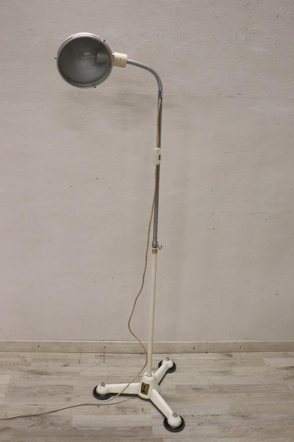 Beautiful medical floor lamp in lacquered metal 1950s German design by Hanau. Working. Very rare for vintage environments. The lamp is height adjustable and the light can be moved in the desired direction. Present original labels.