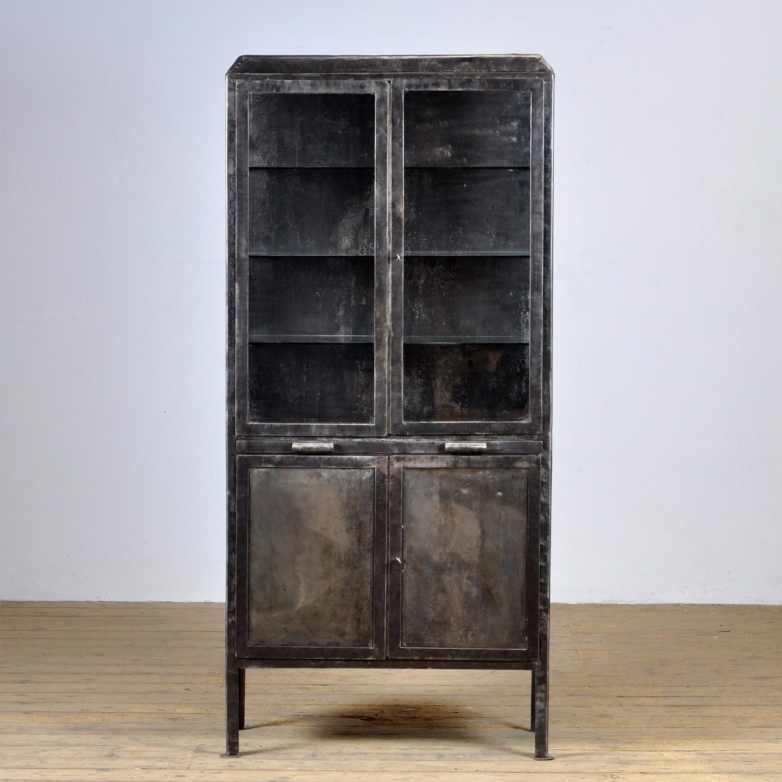 Medical cabinet from the 1930’s. The cabinet is produced in Hungary and is made of thick iron and glass. The locks are original and functional. The cabinet has been stripped to the metal and finished with a rust-resistant oil. The cabinet comes with
