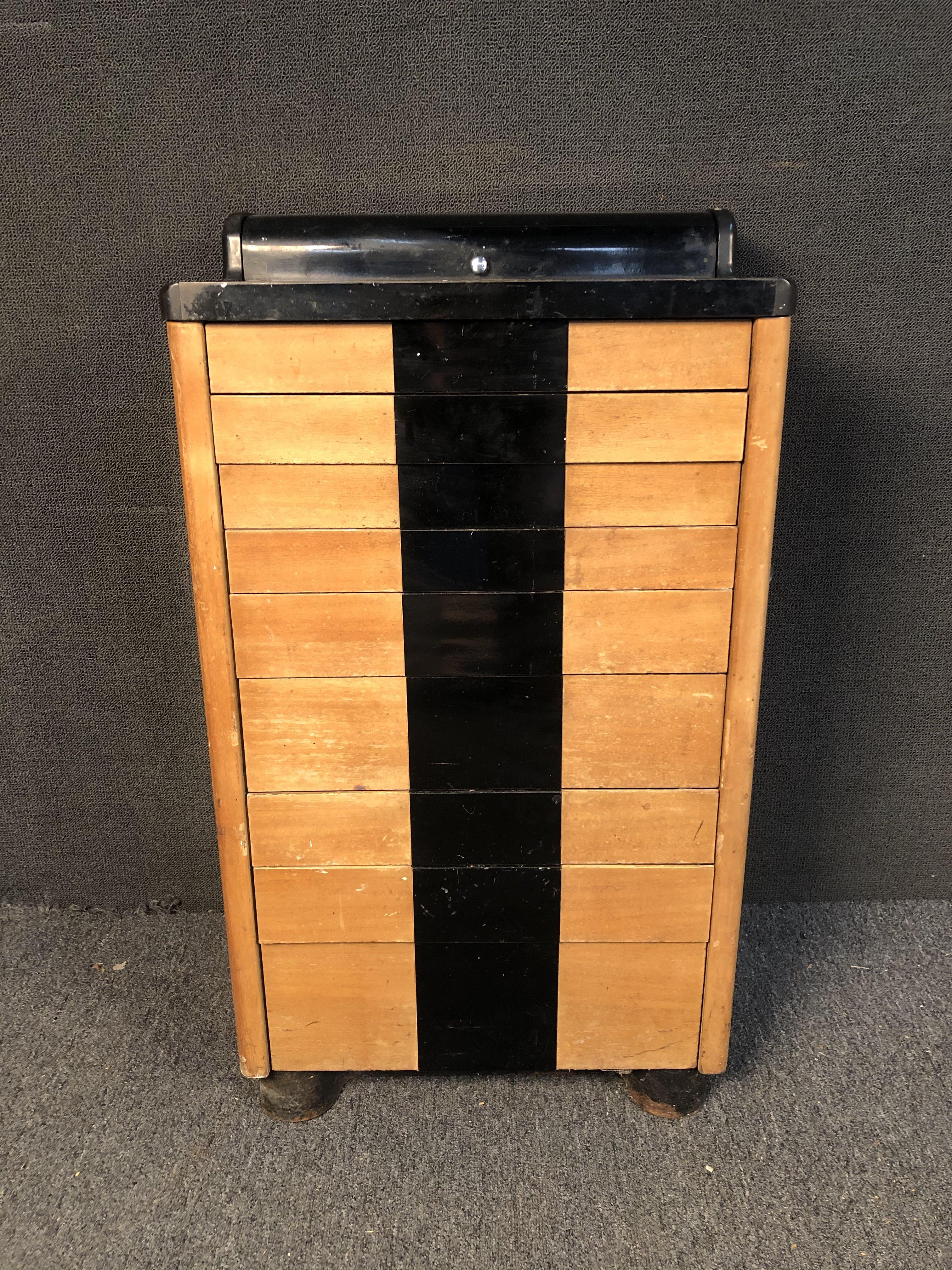 Vintage Medical Cabinet by W.D Allison Co. Cabinet features nine graduated drawers set in a sturdy metal frame with casters and steel handles. Push-release drawers offer optimal organization in any setting, fantastic piece of vintage apothecary