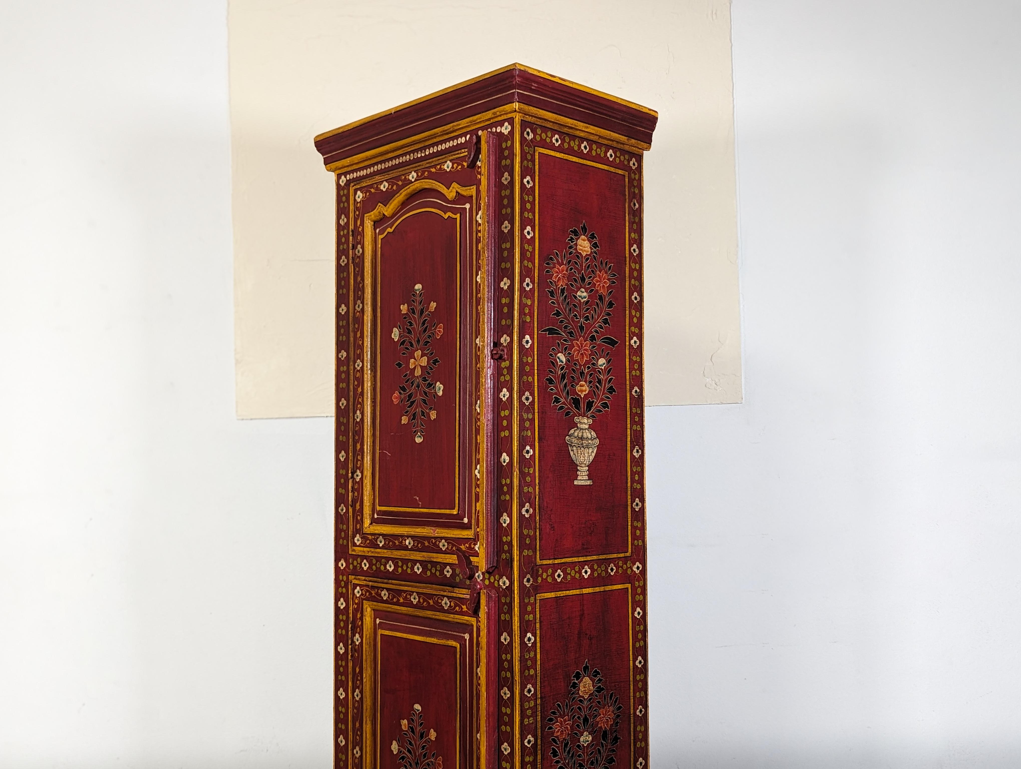 Step into a world of enduring charm with this exquisite vintage Mediterranean-style hand-painted cabinet. An enchanting union of form and function, this piece hails from the late 20th century and boasts the classic allure that only time-honored