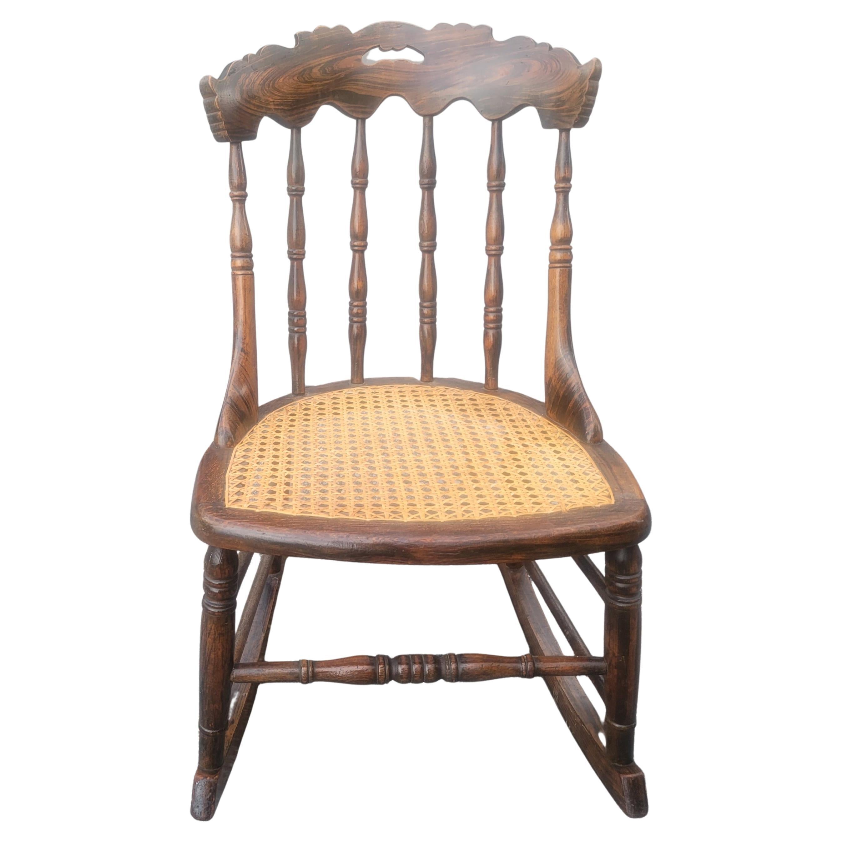 Vintage Medium Size Tiger Walnut and Cane Seat Rocking Chair For Sale