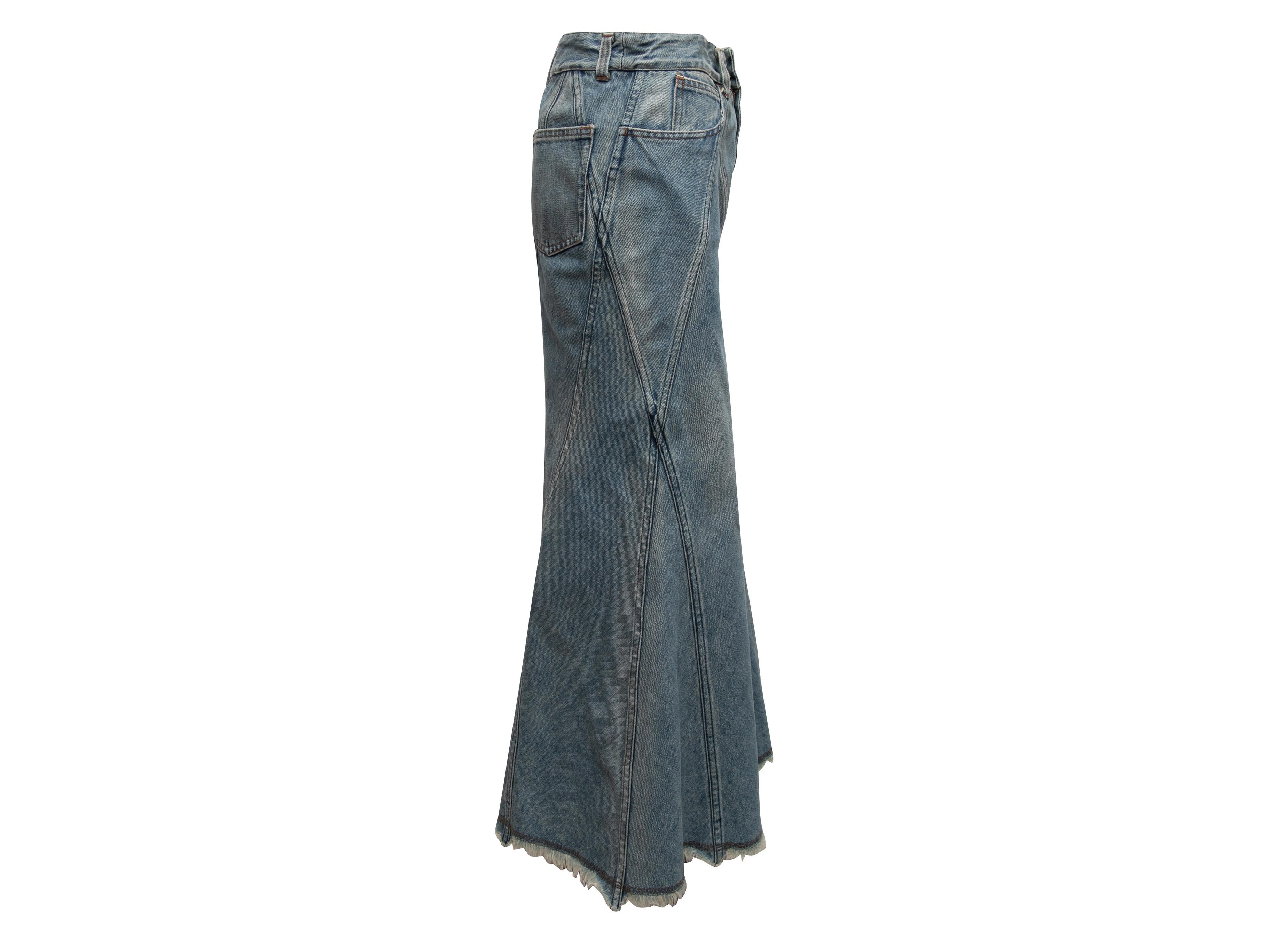 Vintage medium wash flared denim maxi skirt by Junya Watanabe Comme Des Garcons. Circa 2001. Five pockets. Intentional fraying at hem. Zip and button closures at front. 32