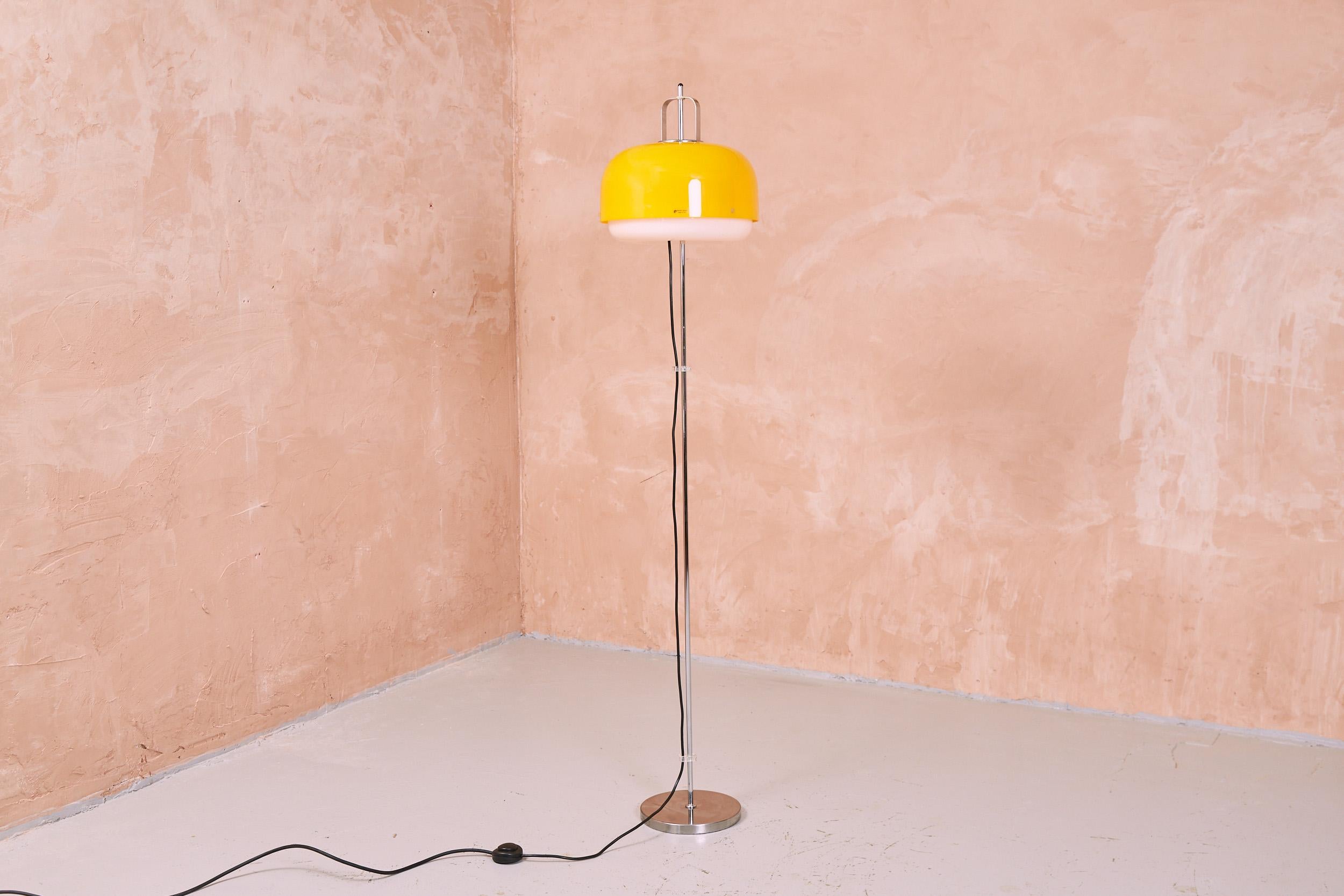 The Medusa floor lamp was designed by Luigi Massoni and produced by the renowned Italian design house Guzzini in the 1970s. The vibrant yellow shade is made from acrylic and has a floating white acrylic underside to give a clean downward light.