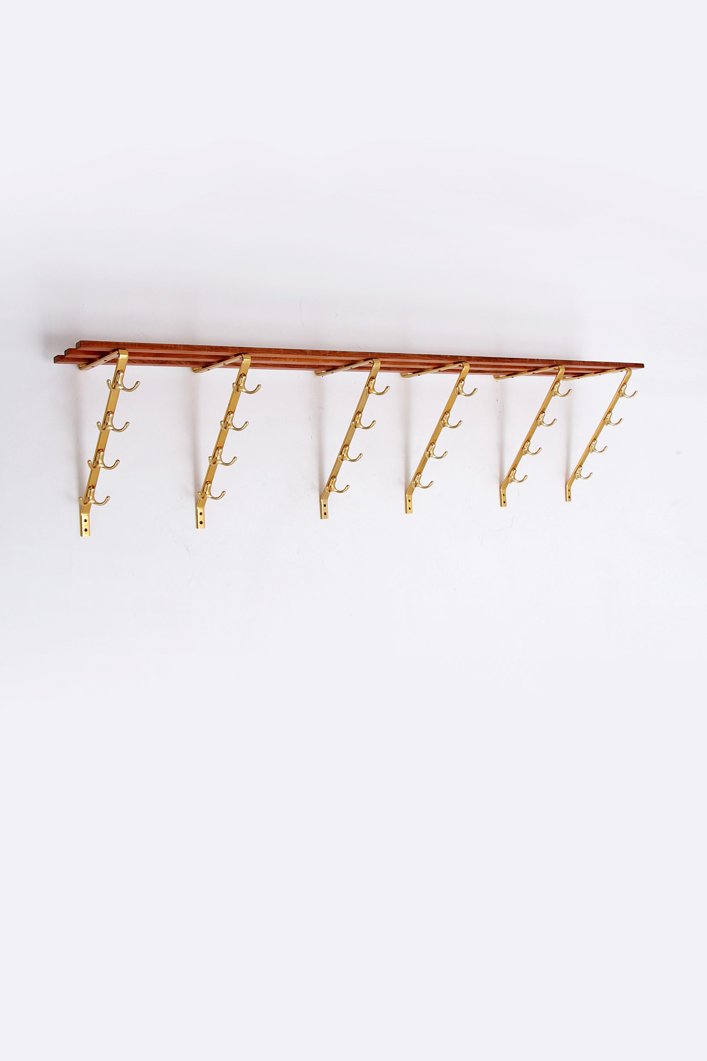Vintage Mega large wall coat rack with 48 hooks, 1960 Germany.

Beautiful, unique, mega-large vintage coat rack with 48 hooks for your home, restaurant or practice. 

Design from the 1960s.

In a beautiful vintage style made of wood with brass