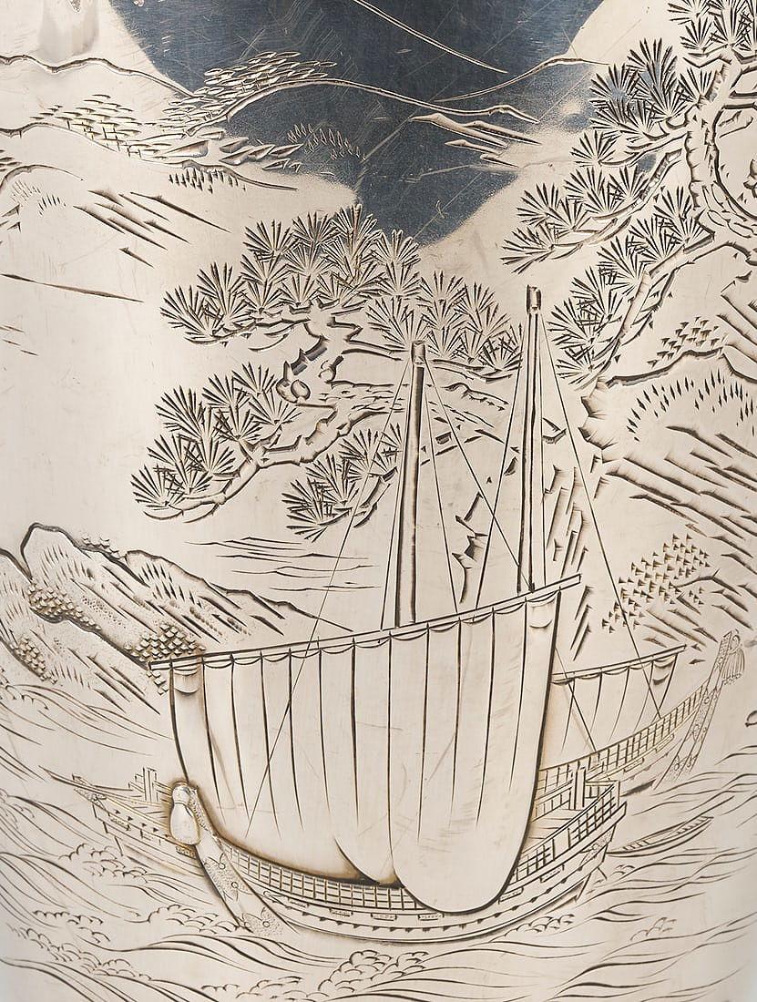 Vintage Japanese pure silver vase measuring 10 3/4 inches tall from the late Meiji to Taisho period featuring finely engraved and raised decorations including Mt. Fuji and sailing vessel.  Inscribed on the side.  Underside with the Jungin mark for
