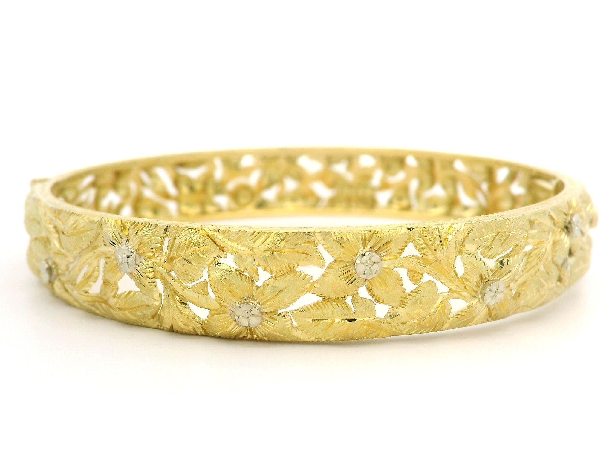 Material: Solid 18k Yellow Gold - White Gold Accent
Weight: 25.44 Grams
Size: Will Comfortably Fit up to 6.75