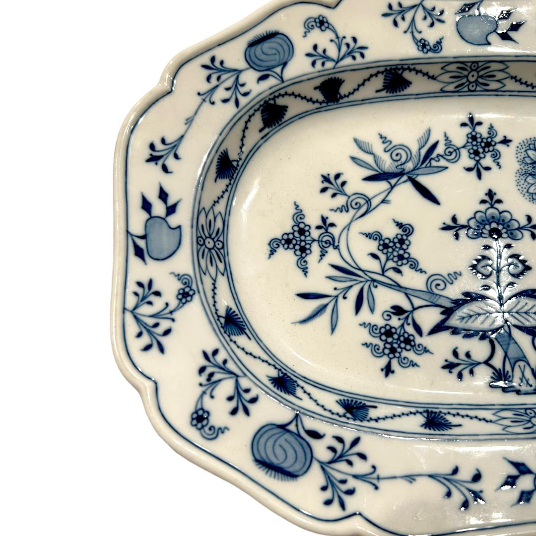 This vintage Meissen “Blue Onion” hand painted porcelain platter is a stunning addition to any collection.  With beautiful blue tones and intricate hand painted details, this platter is sure to catch the eye of any guest. Made from high quality