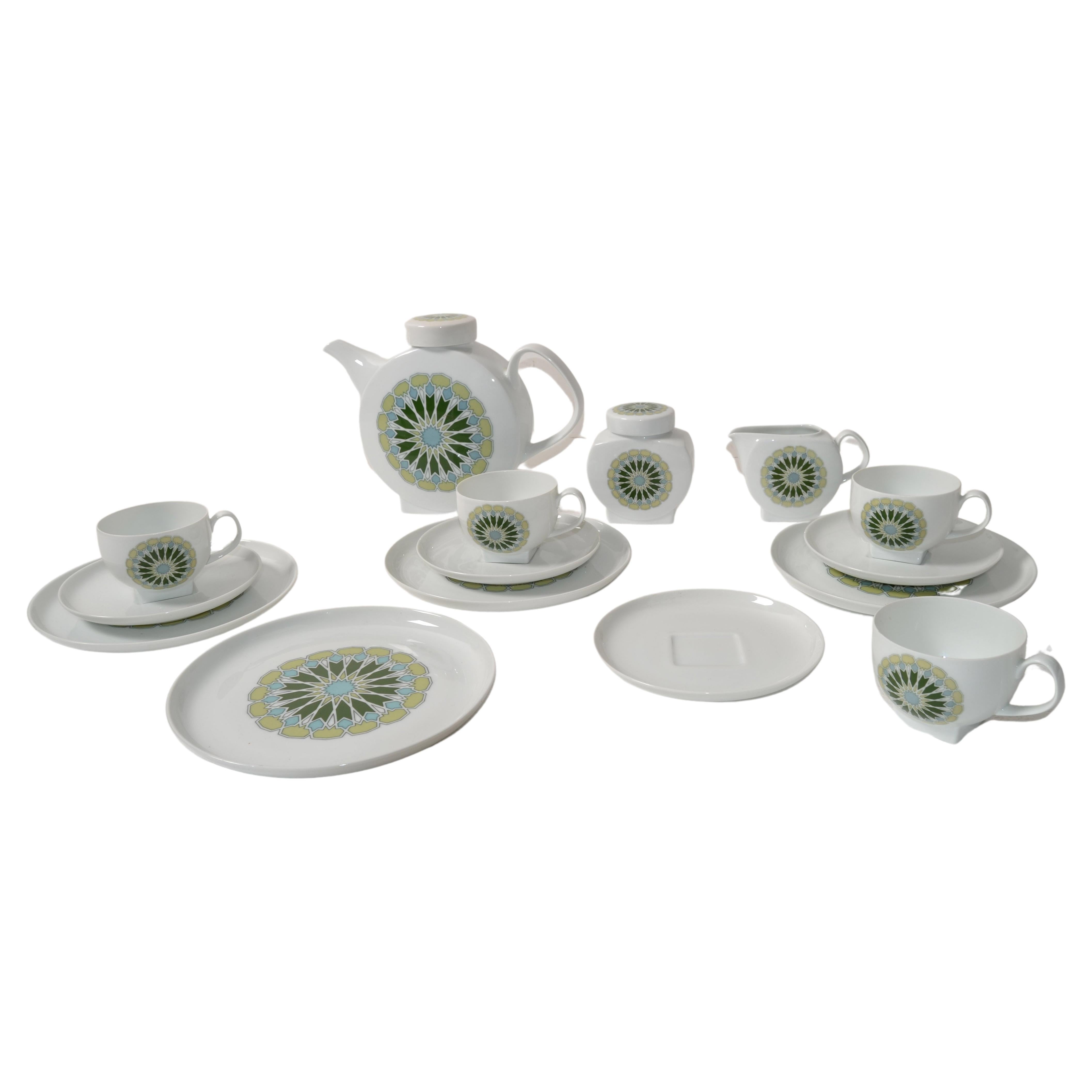 Vintage Op Art Porcelain Tea or Coffee Service for four place setting by Melitta Minden made in Germany circa 1980s.
Beautiful hues of green and turquoise flower motif on ivory white Porcelain.
Consisting of 4 coffee cups with saucers, 4 plates,
