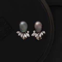 Orecchini vintage Mellerio dits Meller in platino con perla tahitiana e diamanti