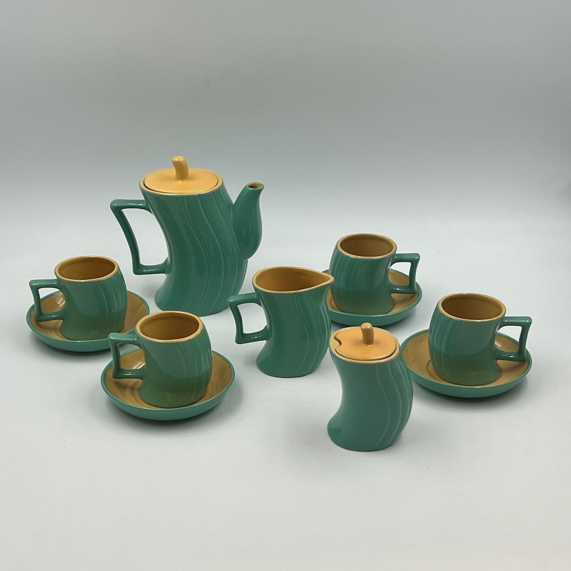 Experience the iconic style of the 80s design movement with this rare and amazing tea or coffee set designed by Massimo Iosa Ghini for Memphis Naj Oleari in the 1980s. This beautifully crafted ceramic set is a unique representation of the vibrant