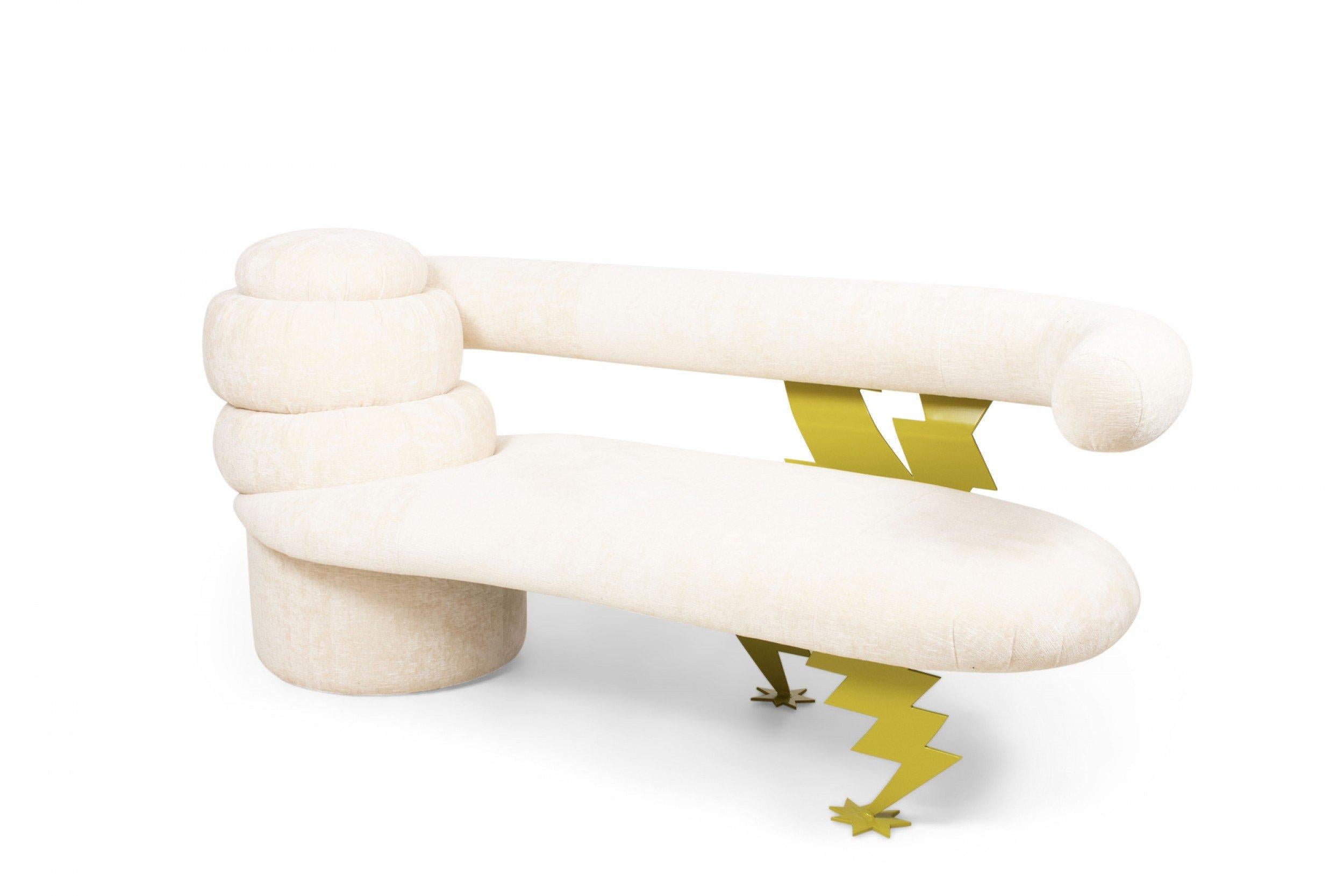 Vintage Memphis-style (1980s) beige textured velvet upholstered bench / sofa with a circular tiered right arm extending to a curved tube back rest supported by a gold powder-coated plastic frame shaped like striking lightning bolts with spiked