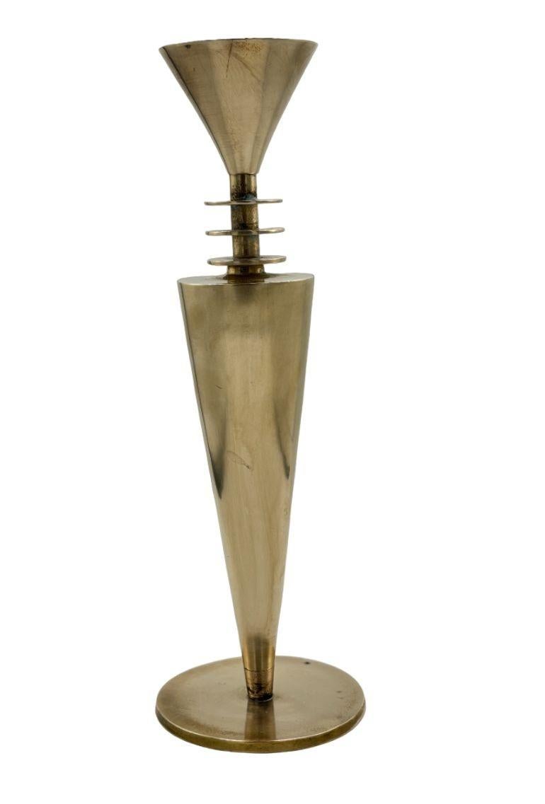 Step into the whimsical world of the 1980s with this Vintage Memphis Style Brass Candlestick Holder, a stunning fusion of form and function. Standing at a height of 10.24 inches (26 cm) with a diameter of 2.96 inches (7.5 cm), this piece showcases