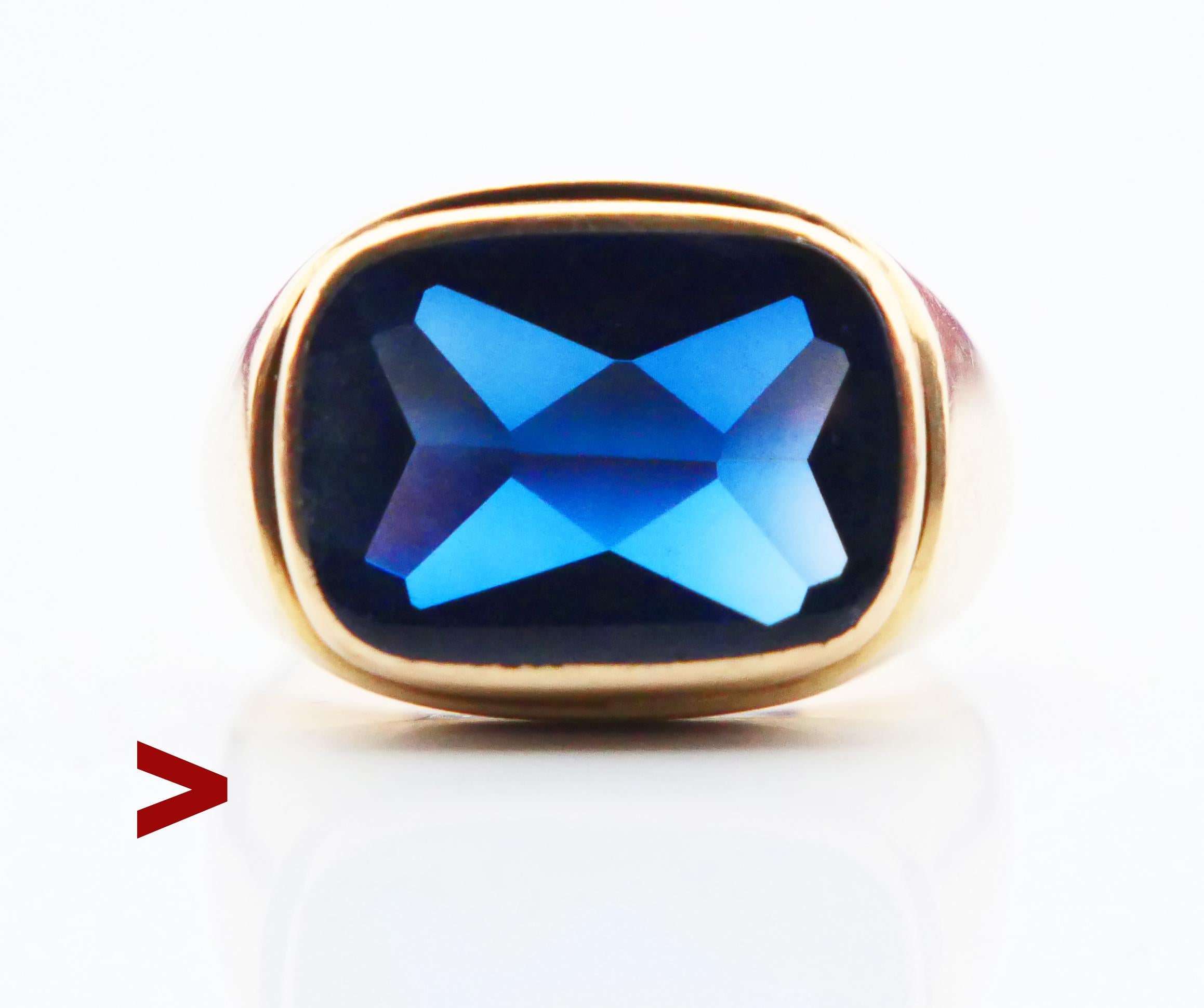 Ring for Men adorned with bezel set Blue Sapphire stone (lab made), a bit convex shaped with polished face and intricately faceted back sides measuring 15 mm x 11 mm.

Stone is dark Blue, it may look differently under various types of light. This