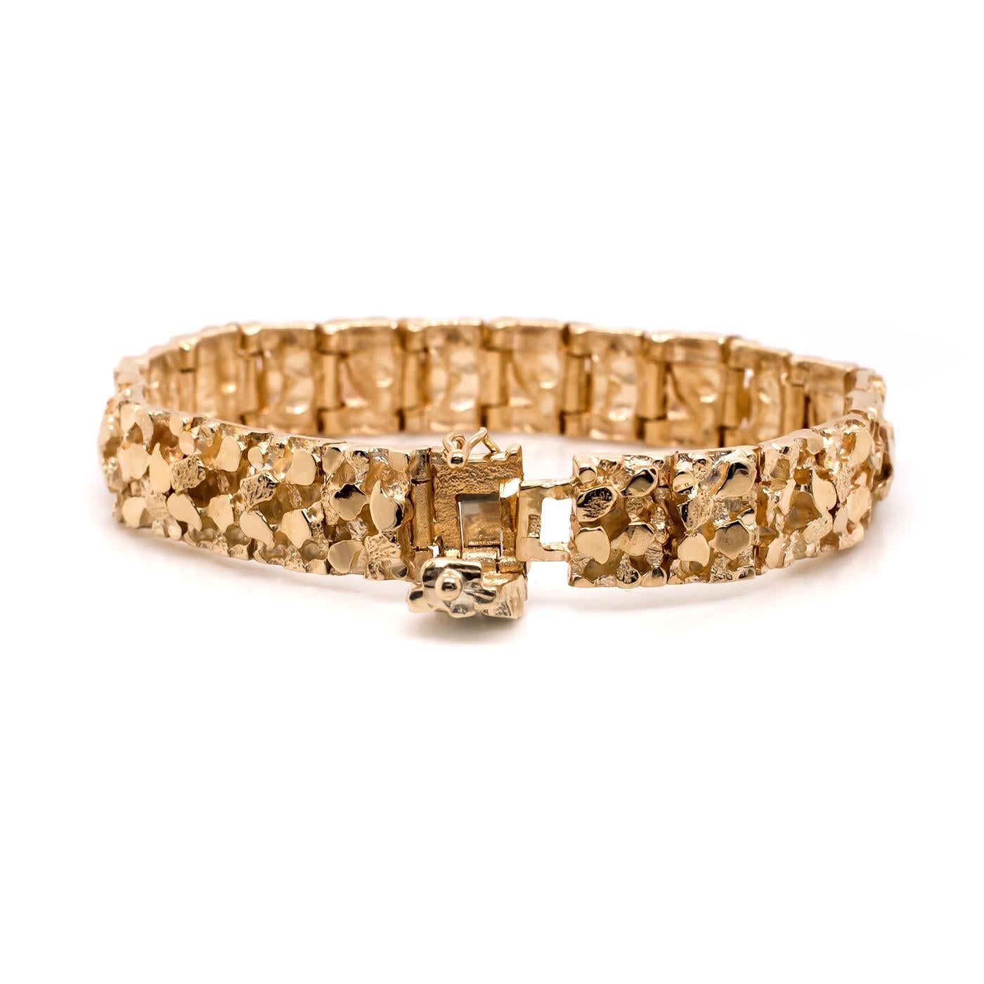 This Bold Vintage 14 Karat Yellow Gold Nugget Bracelet is the greatest statement piece. It is in twenty-three (23) gold nugget link segments allowing for flexibility and comfort all the way around. Measuring 7'' but  can be sized down in size prior