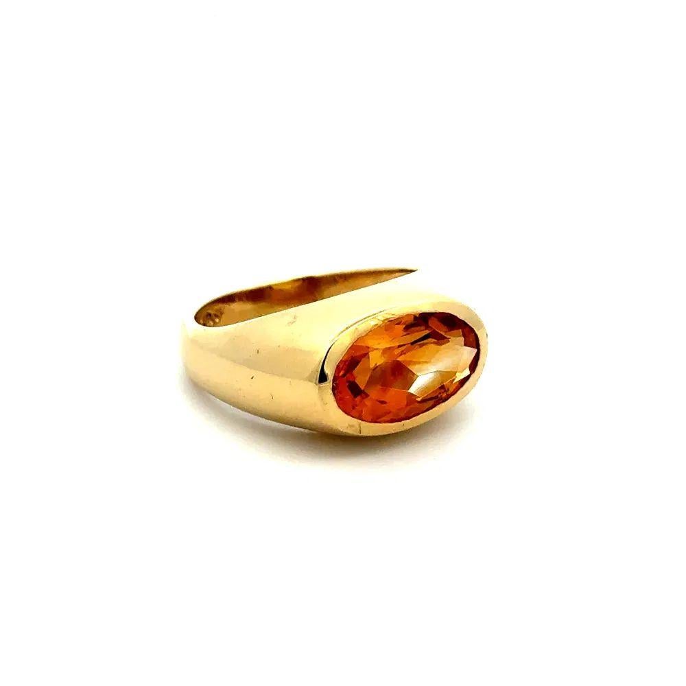 Handsome Gent’s Oval Citrine Gold Bezel Dome East West Signet Ring. Centering a securely Hand set Oval Citrine, weighing approx. 4 Carats. Hand crafted 14K Yellow Gold Bezel Dome East West mounting. Measuring approx. 0.80” L x 0. 4” W. Ring size