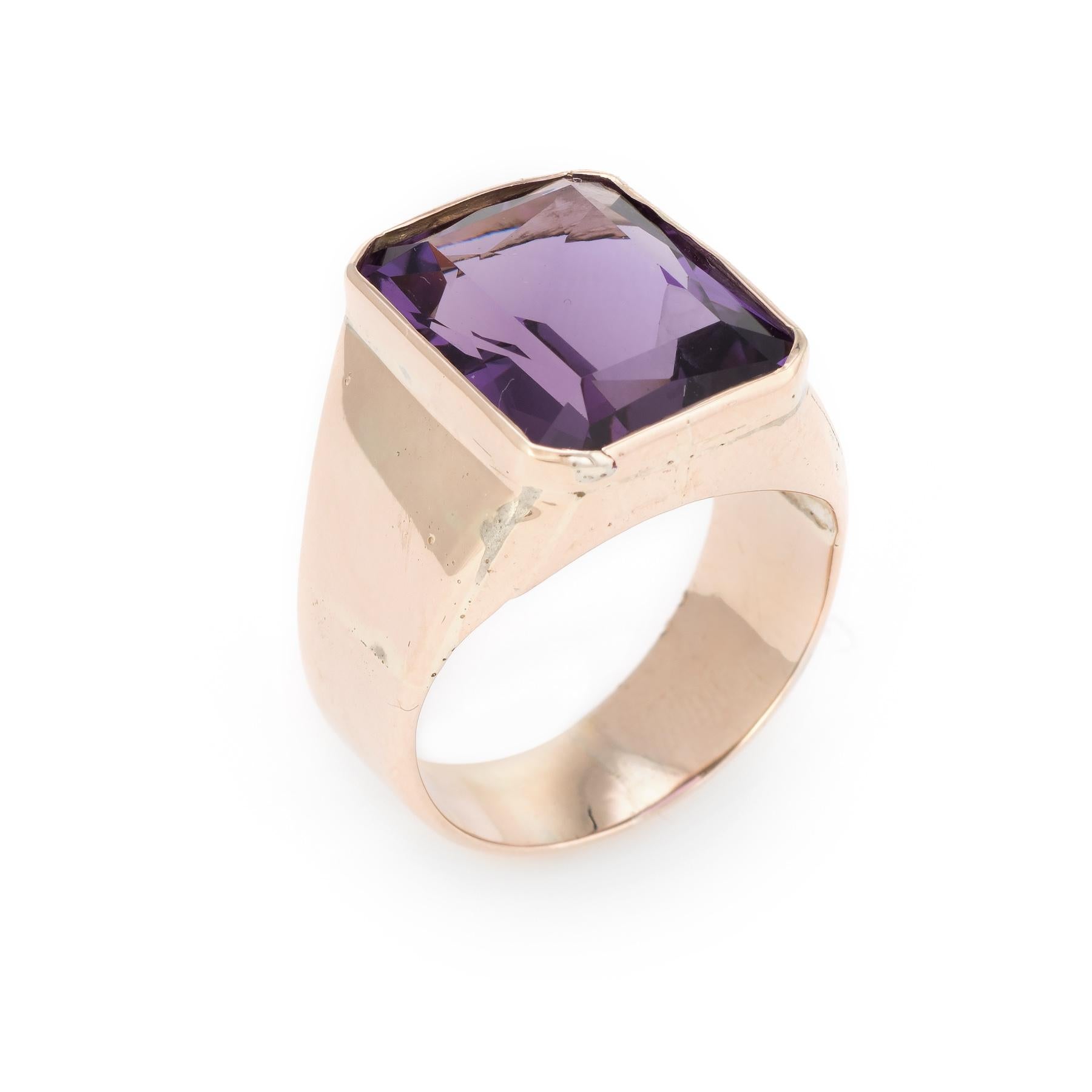Finely detailed vintage men's cocktail ring (circa 1960s to 1970s), crafted in 10 karat yellow gold. 

Rich purple amethyst measures 15mm x 12mm (estimated at 12 carats). The amethyst is in excellent condition and free of cracks or chips. 

The