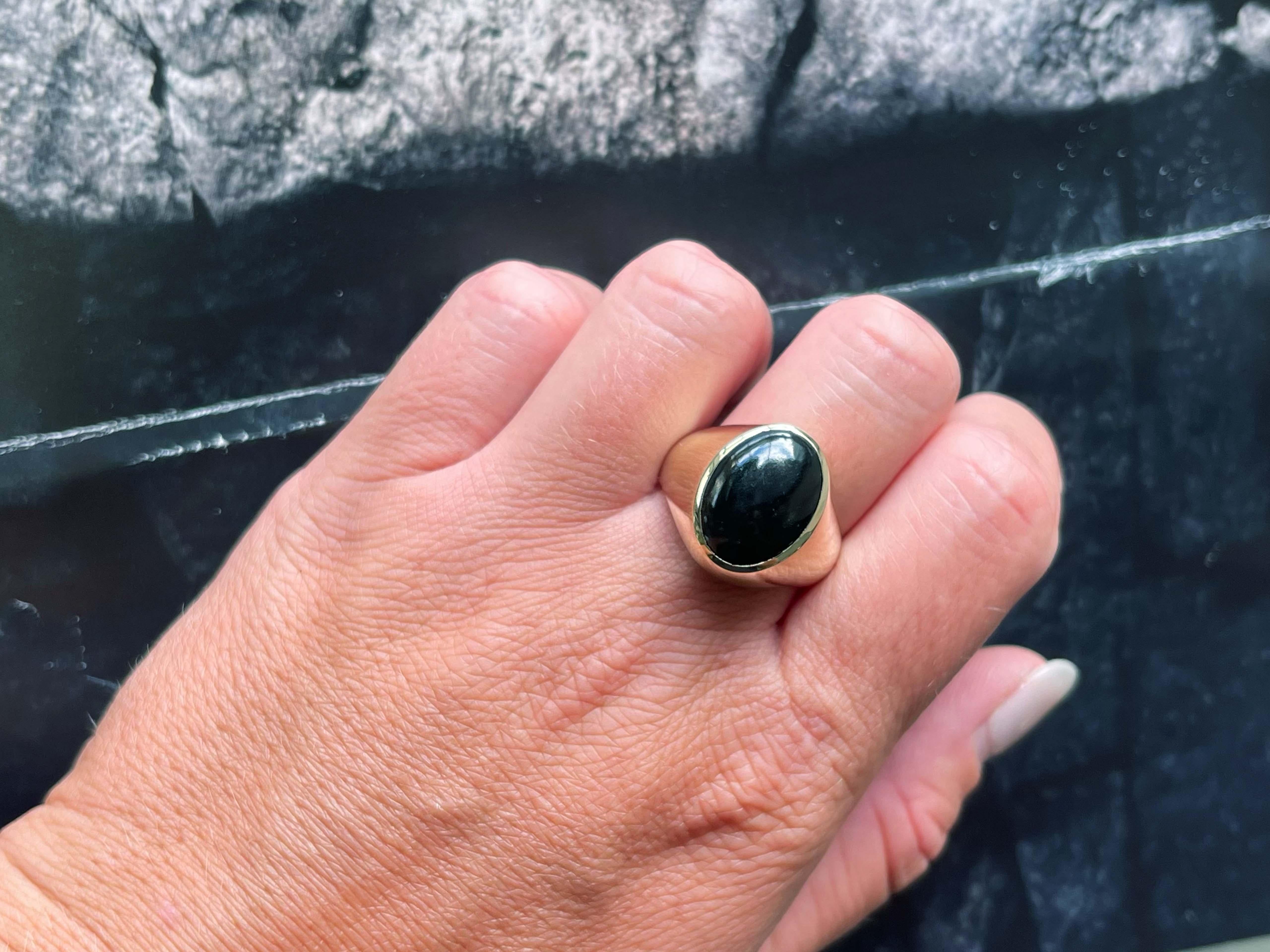 Item Specifications:

Metal: 14K Yellow Gold

Style: Statement Ring

Ring Size: 11 (resizing available for a fee)

Total Weight: 10.3 Grams

Gemstone Specifications:

Center Gemstone: Onyx

Shape: Oval

Color: Black

Cut: Oval Cabochon 

Gemstone