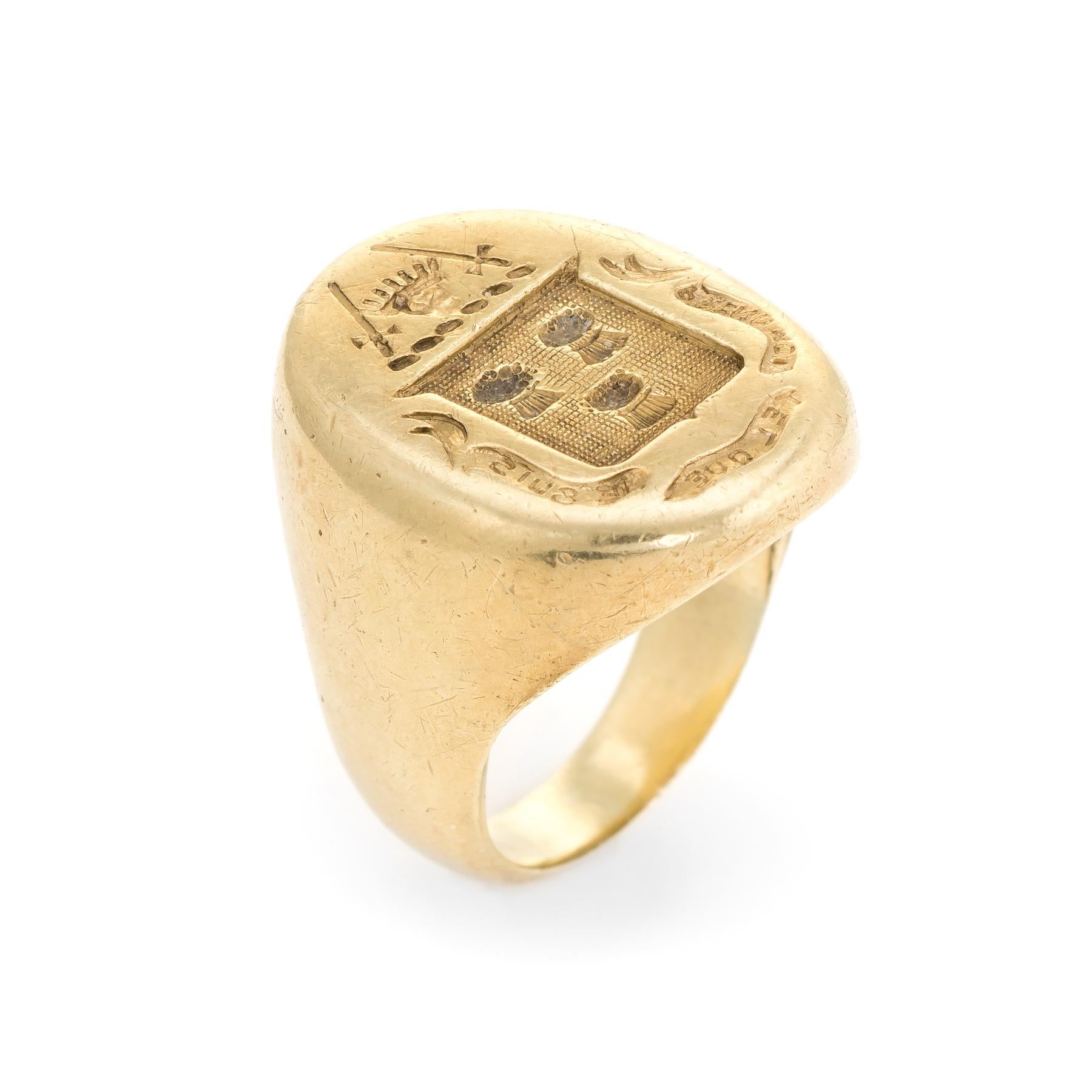 Finely detailed Men's signet ring, crafted in 14 karat yellow gold. 

The mount features a family crest with two swords placed against crown. The center of the crest features what appears to be three Scottish thistles (another possibility is three