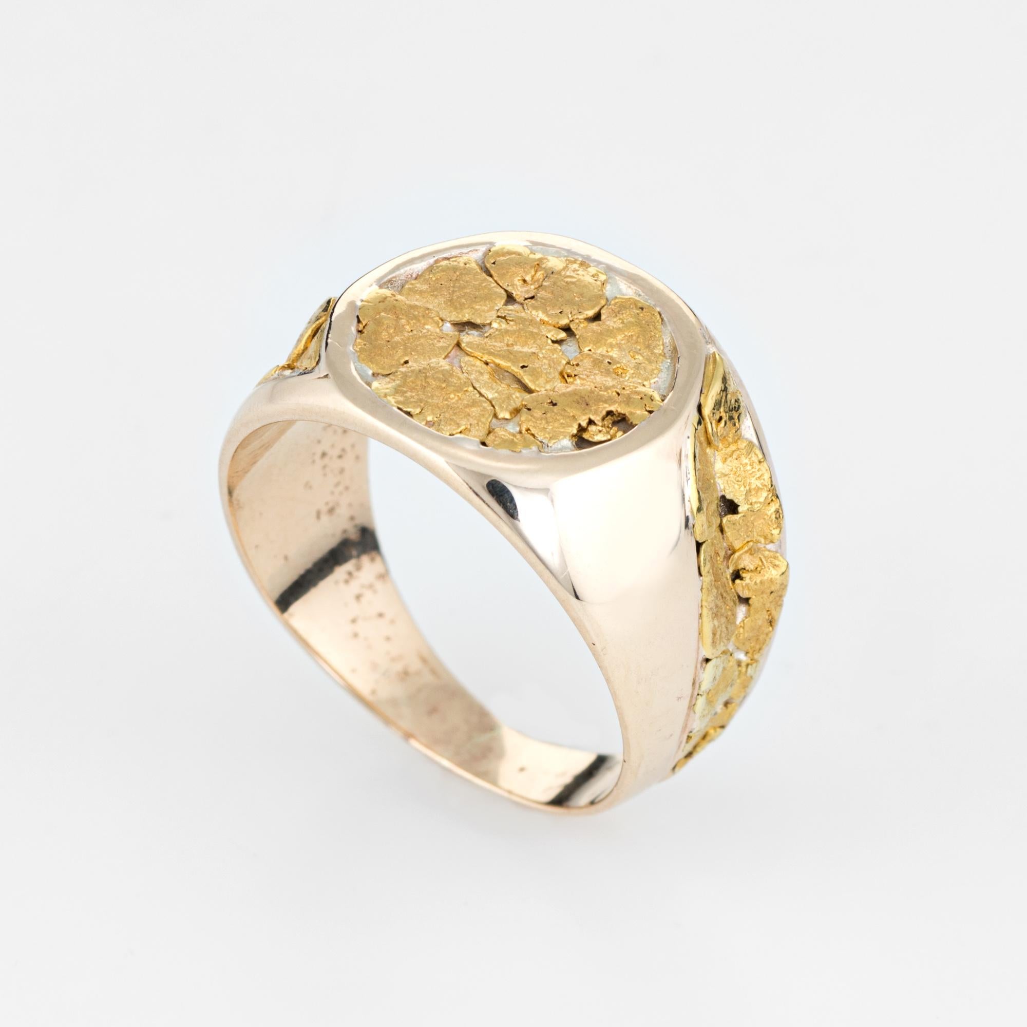 Vintage men's nugget signet ring (circa 1970s to 1980s), crafted in 10 karat yellow gold. 

The gold nuggets are set in random from into the round signet mount and side shoulders. With a low profile and slightly curved saddle the ring sits
