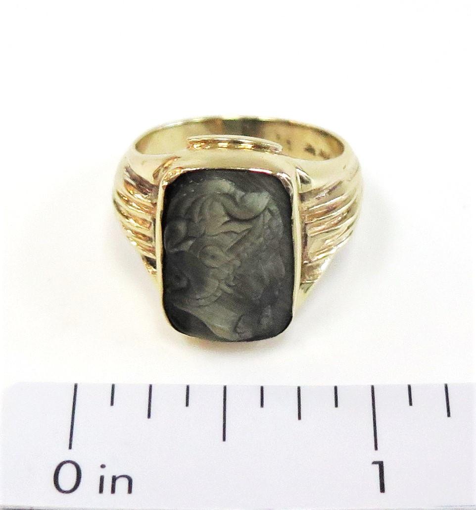 I have seen many carved Tigers Eye rings. But I could not find another carved Cats Eye ring. This beautifully carved men's Cats Eye Intaglio ring features 2 roman head soldiers. It is an unusual and beautifully carved men's vintage ring. 

14 karat