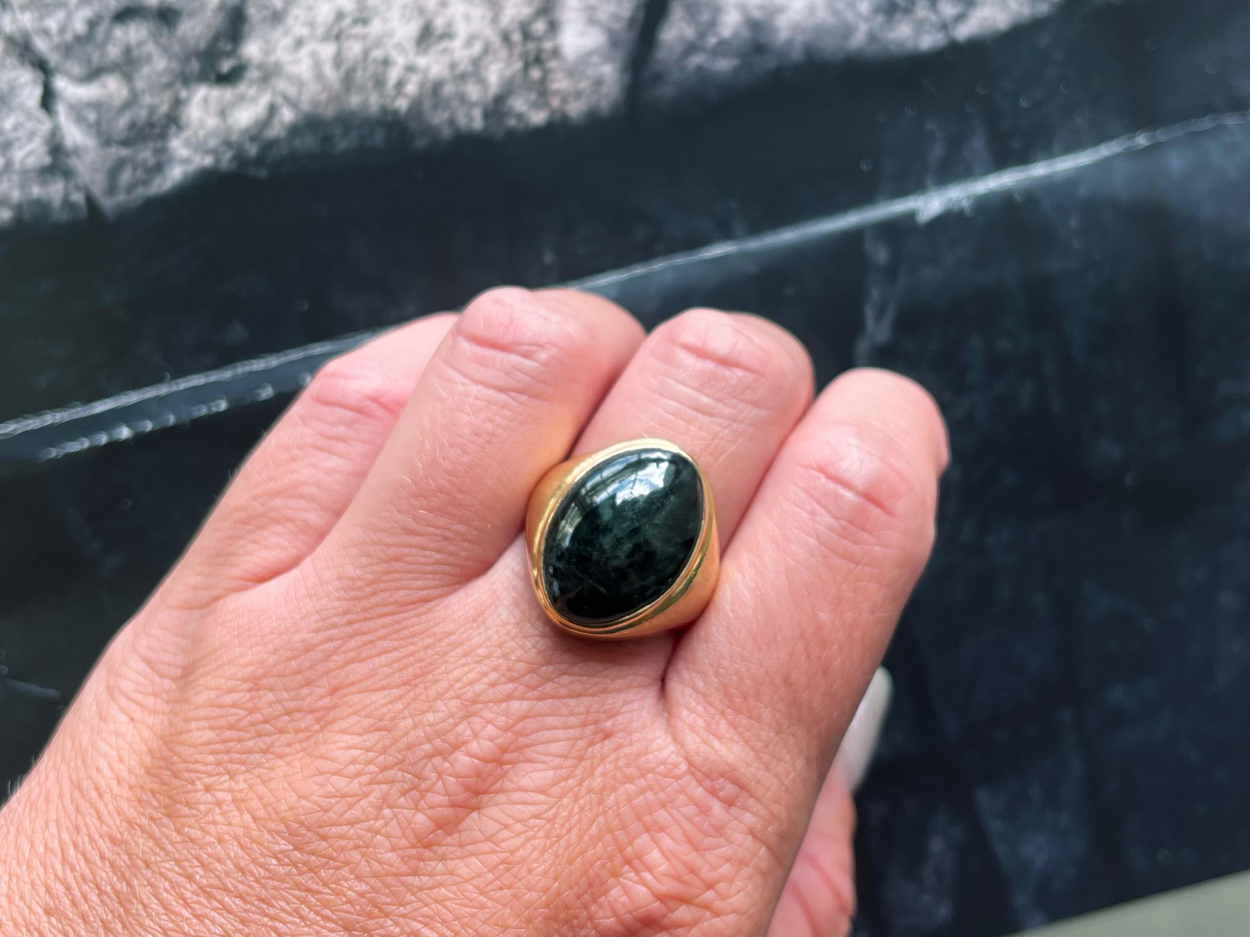 Item Specifications:

Metal: 14K Yellow Gold

Style: Statement Ring

Ring Size: 10 (resizing available for a fee)

Total Weight: 8.2 Grams

Gemstone Specifications:

Center Gemstone: Jade

Shape: Oval

Color: Black

Cut: Cabochon 

Gemstone