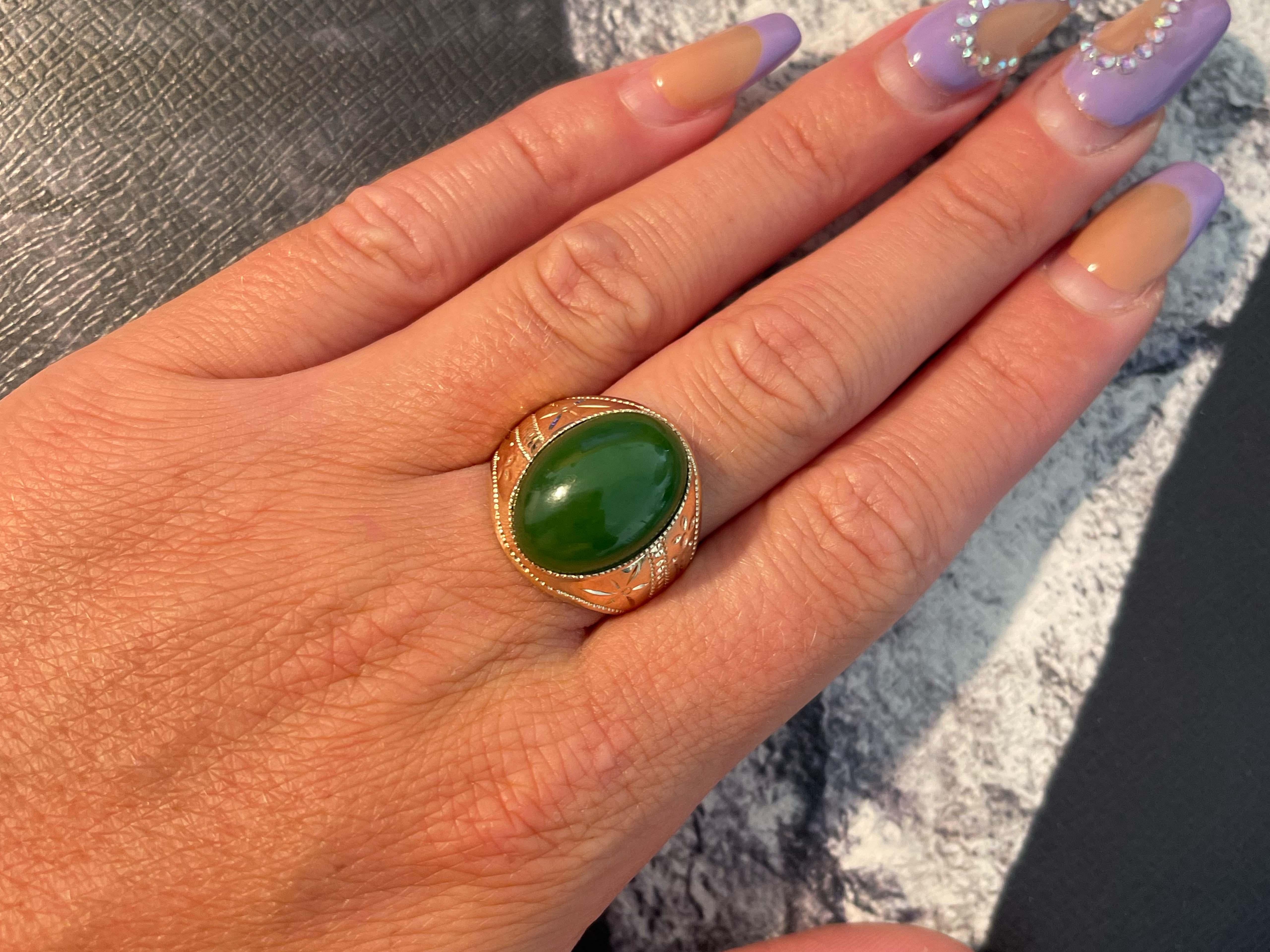 Vintage Men's Oval Dark Green Jade Ring in 18k Rose Gold. Magnificent vintage oval double cabochon dark green jadeite jade ring in 18k rose gold. The beautiful even toned green Jade is bezel set and measures approximately 18.29 mm x 13.33 mm. The