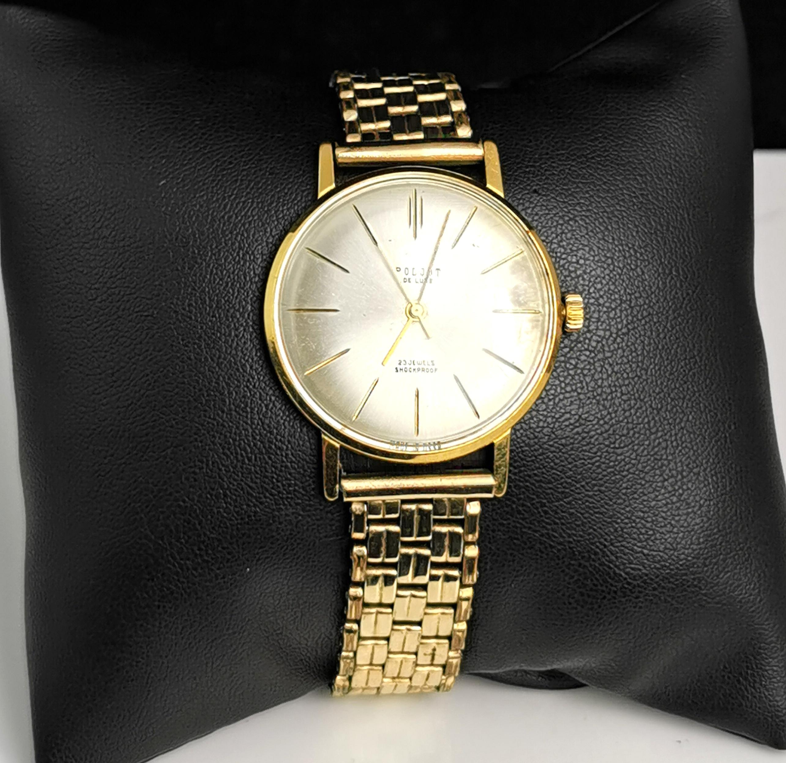 A stylish vintage Russian Poljot De Luxe gold plated watch.

This is a bracelet strap watch with an elegant circular shaped face and a champagne coloured dial and gold tone hands.

Marked on the face 23 jewels, Shockproof.

It is rolled gold and