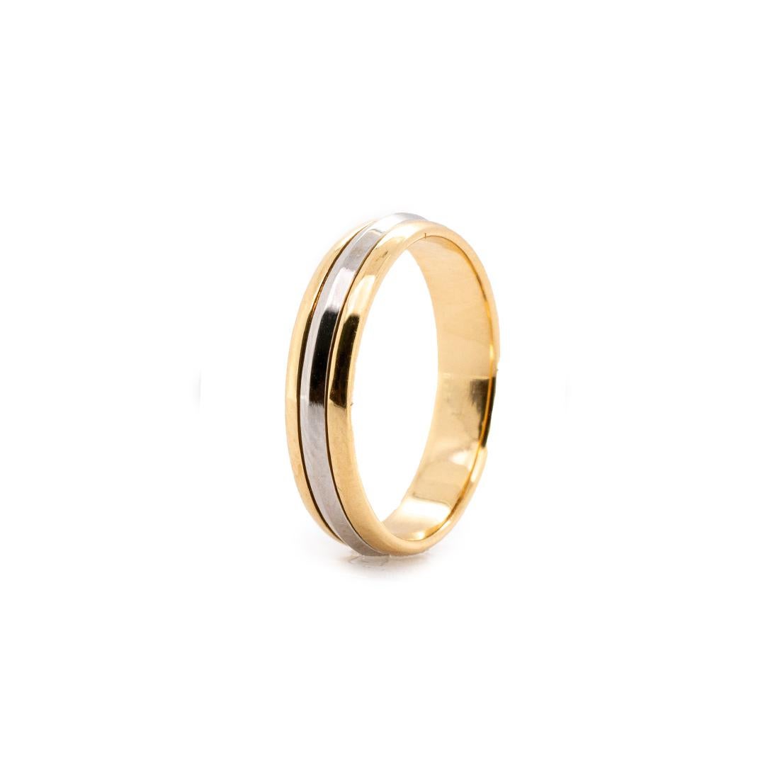 One man's designer made, hand made polished, platinum and 18K yellow gold three-row, wedding, vintage, solitaire band with a half-round shank. The band is a size 11 and measures approximately 5.00mm in diameter and weighs a total of 7.18 grams.