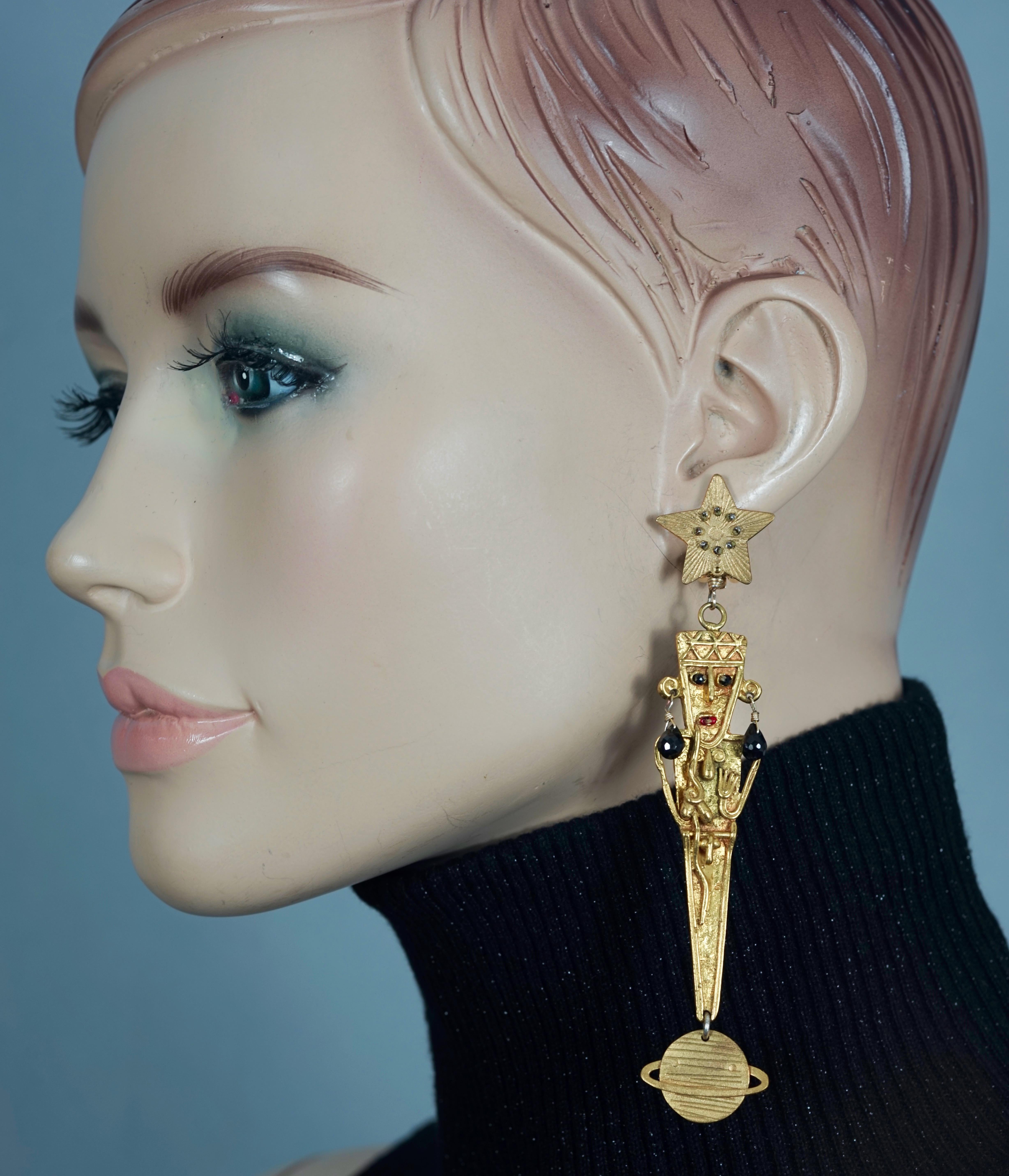 Vintage MERCEDES SALAZAR Figural Star Saturn Dangling Earrings

Measurements:
Height: 4.53 inches (11.5 cm) 
Width: 0.78 inch (2 cm)
Weight per Earring: 13 grams

Features:
- 100% Authentic MERCEDES SALAZAR.
- Depicting star, human figure and Saturn