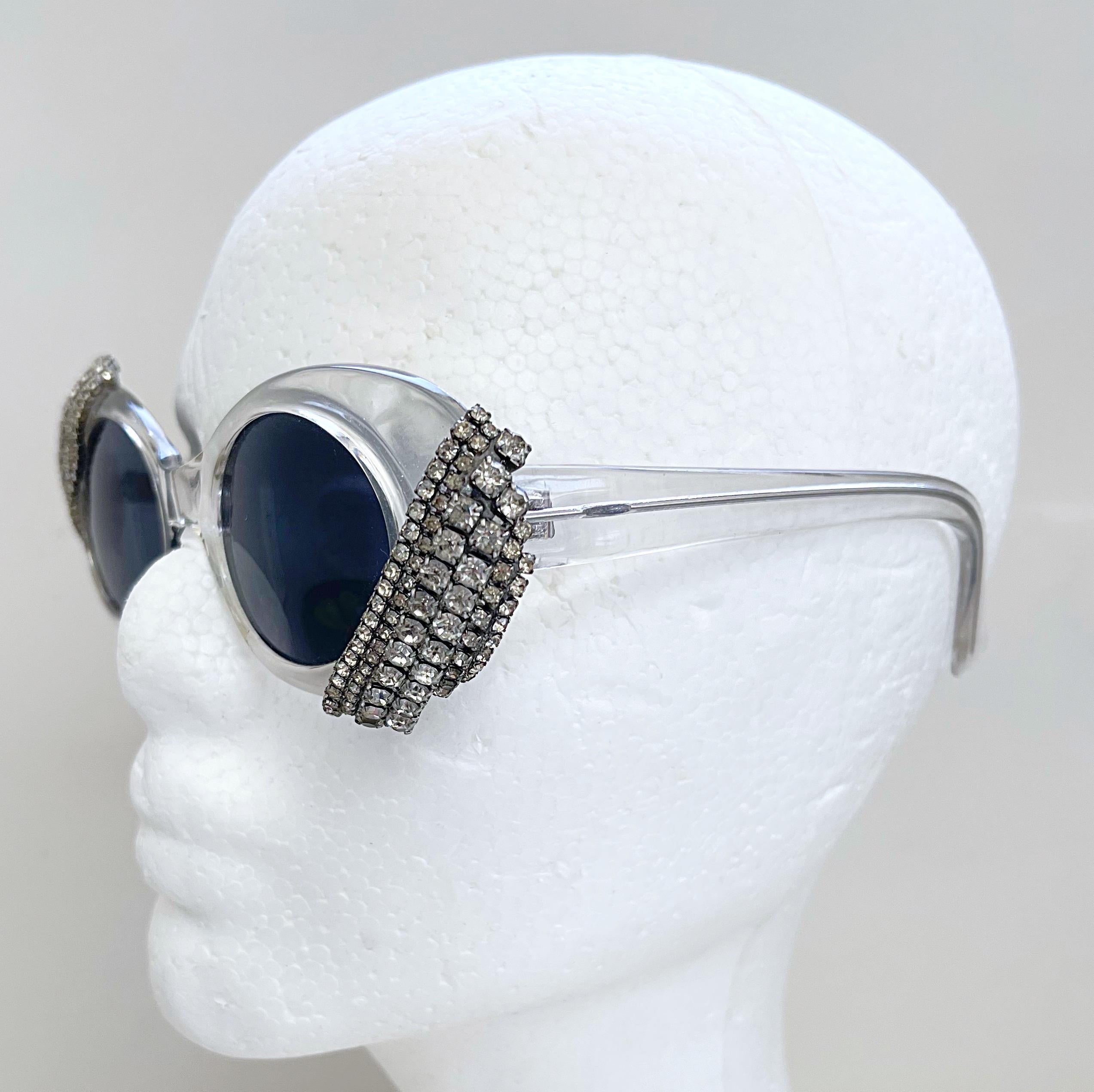 Super rare, and Rihanna favorite, MERCURA NYC novelty sunglasses ! These glasses are everything ! Jackie O oval shape with clear lucite. Rhinestones at each upper and lower corner. Great for any size face shape. Hand made in 
New York City
In great