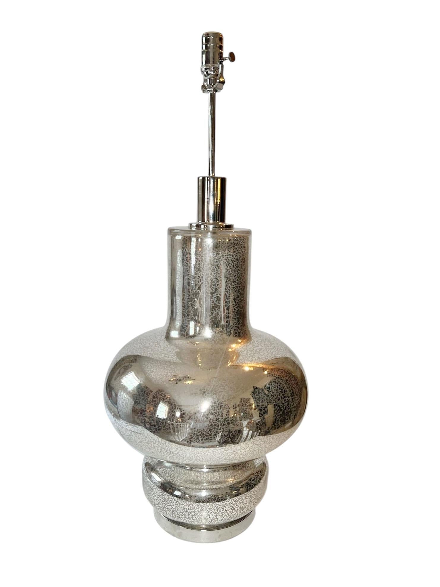 A striking pair of vintage mercury glass lamps, blending bohemian warmth with the silvery shimmer of mercury glass. The inside of Lamp lights up is also electrified. 