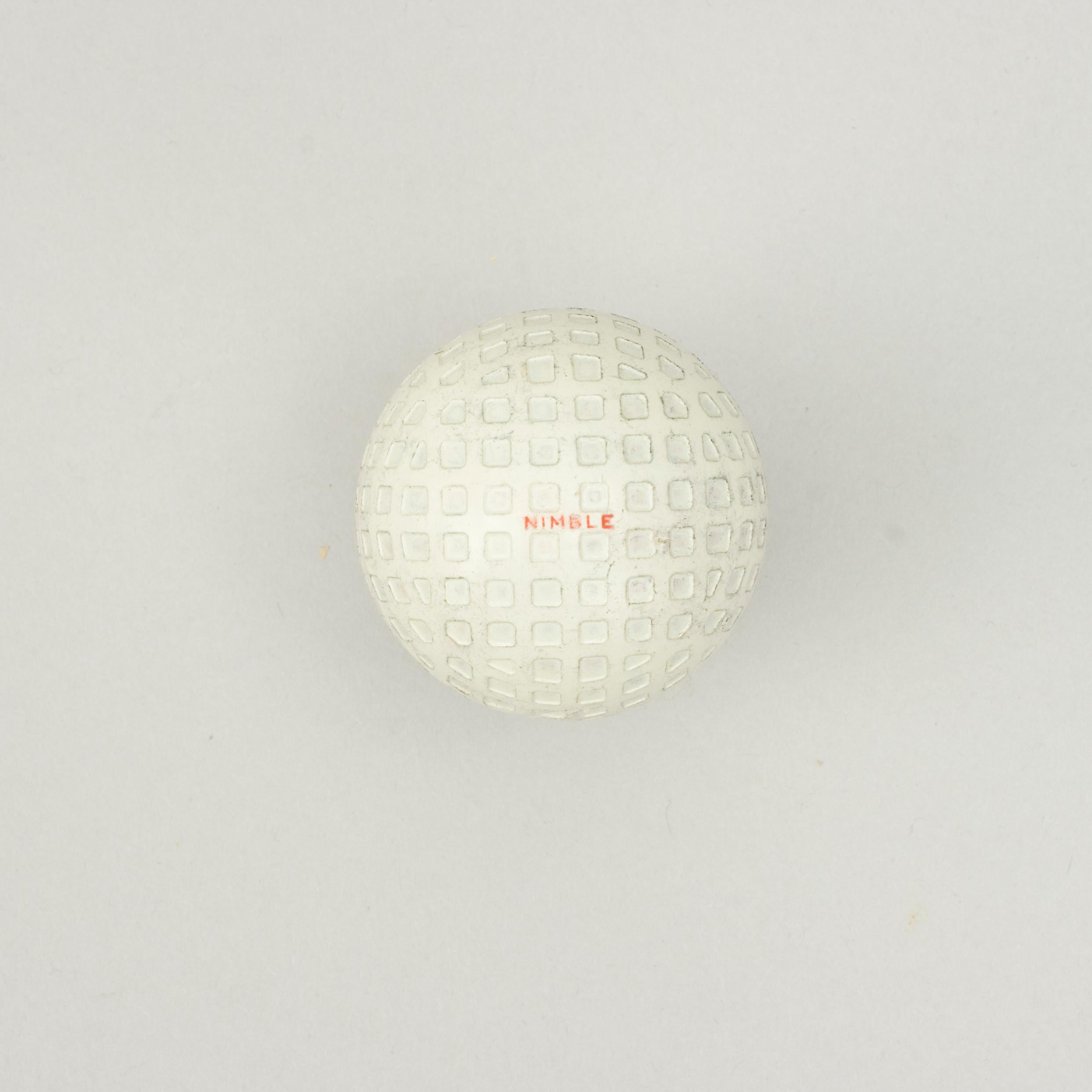 Spalding 'Nimble' Mesh Pattern Golf Ball.
A 1930's Spalding rubber core golf ball in very good condition. The ball has a square mesh or lattice pattern and is called 'Nimble'. The ball is marked 'Nimble' on both poles in red and is with a mesh