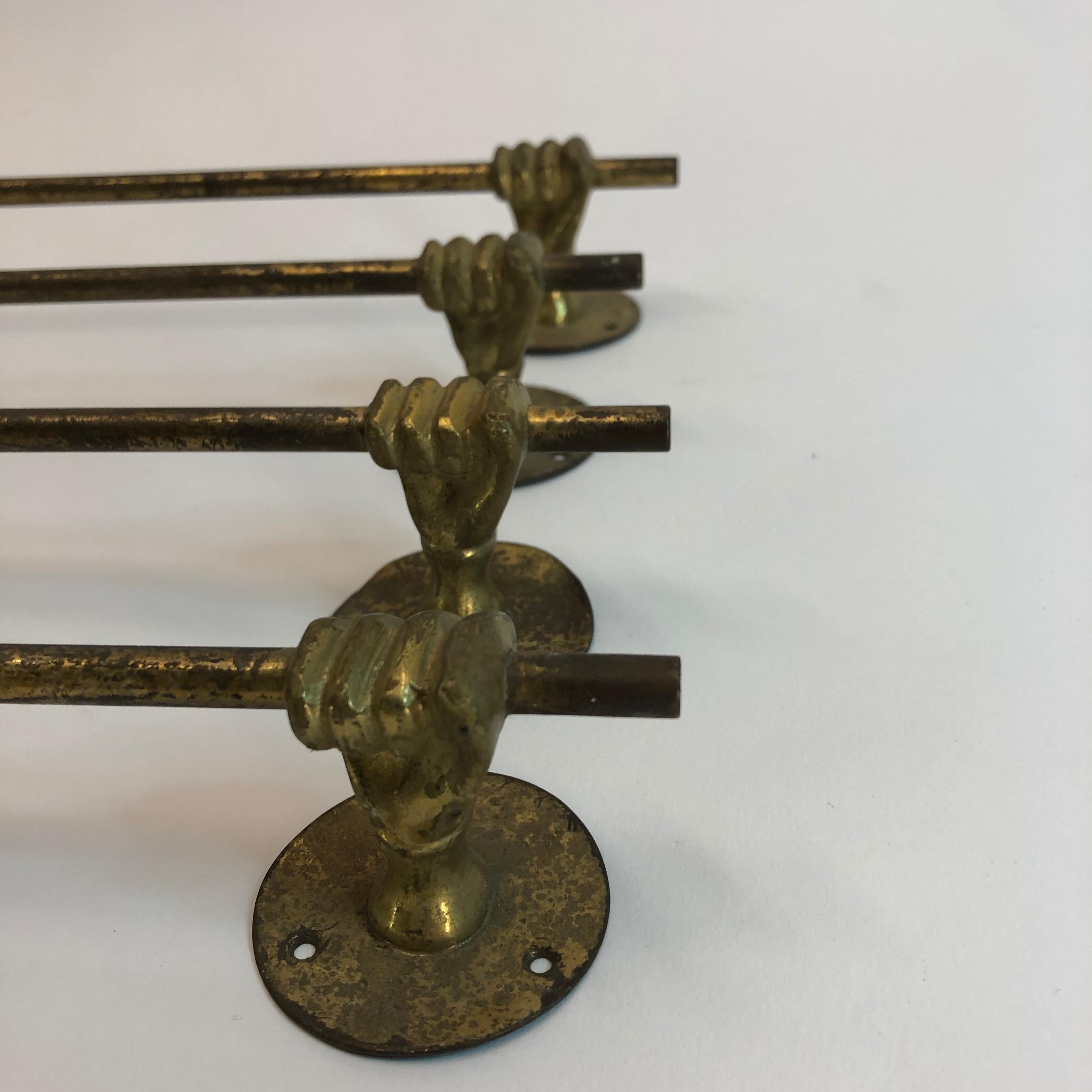Vintage metal/brass hands/fists holding a towel rail, set of 4.
The rails are in used vintage condition. They came out of from a beautiful French chateau's kitchen.
Measurements:
Length total 37 cm (between hands 28 cm)
Depth total 4 cm (rail to
