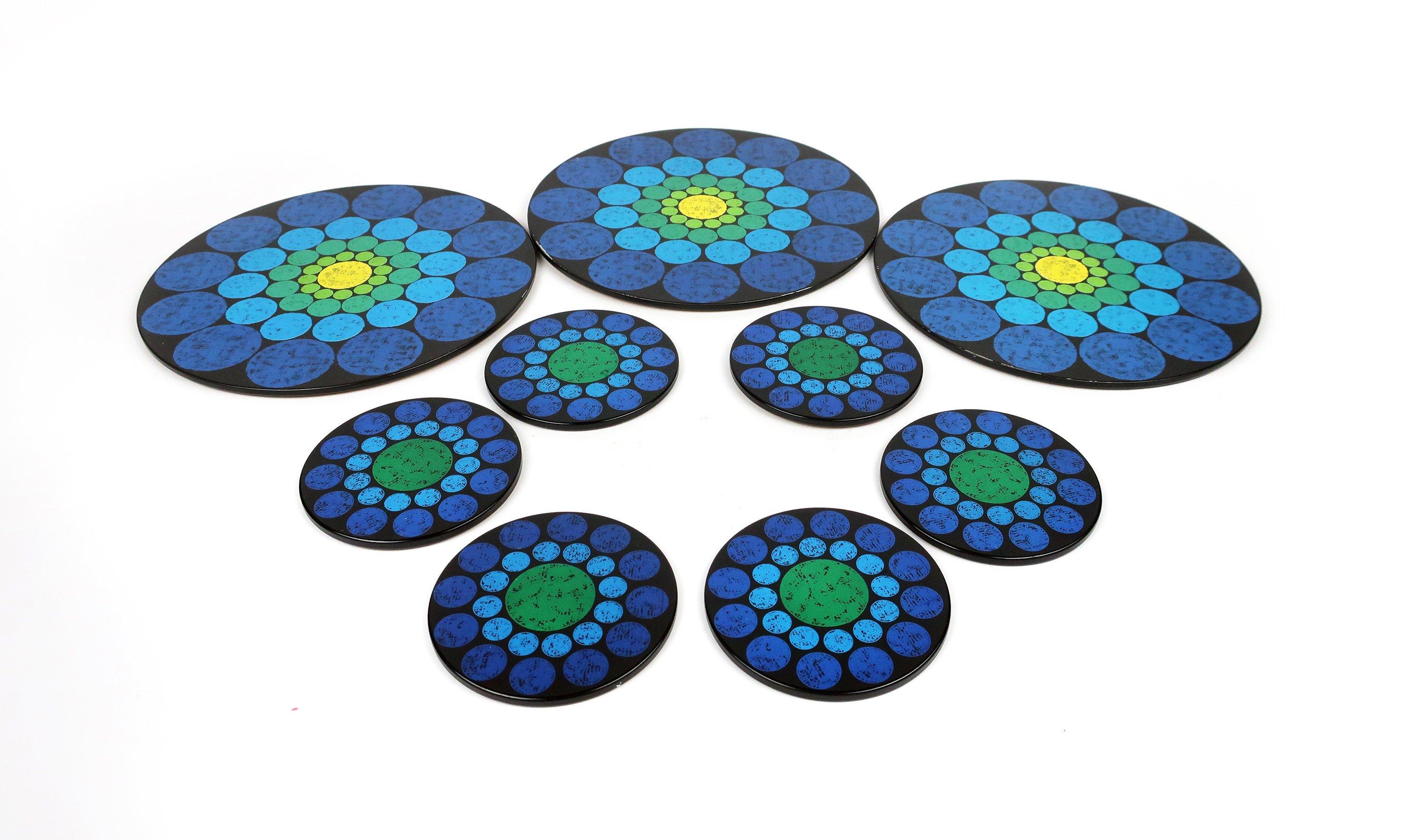 A great set of late 1960s-early 1970s Worcester Ware coasters and trivets with a fantastic pattern of multi colored concentric circles in that resemble the pedals of a flower. The six coasters are two shades of blue. The 3 trivets are two shades of