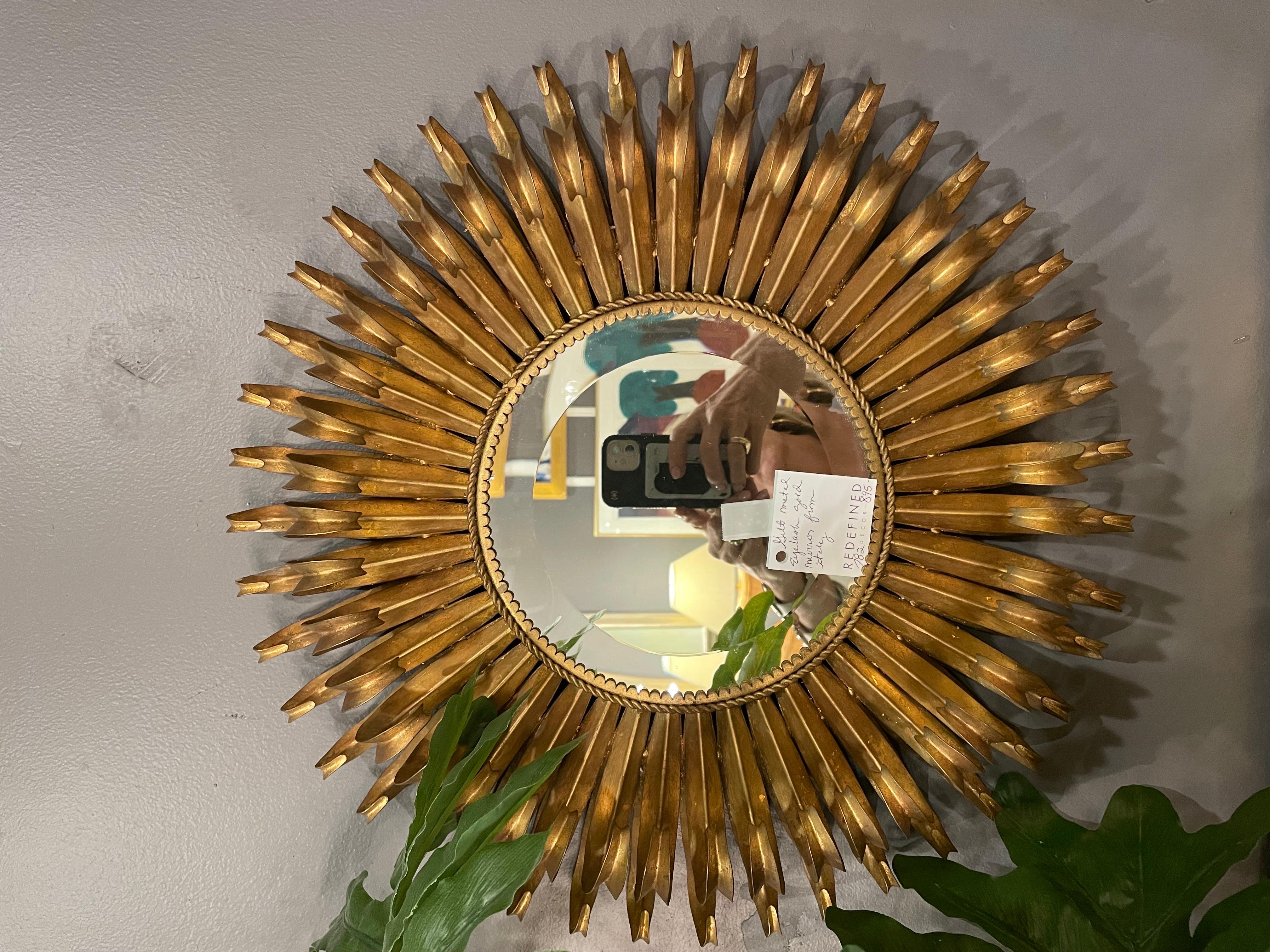 This is a modern looking metal , gold colored eyelash mirror from 1970 in great vintage condition 