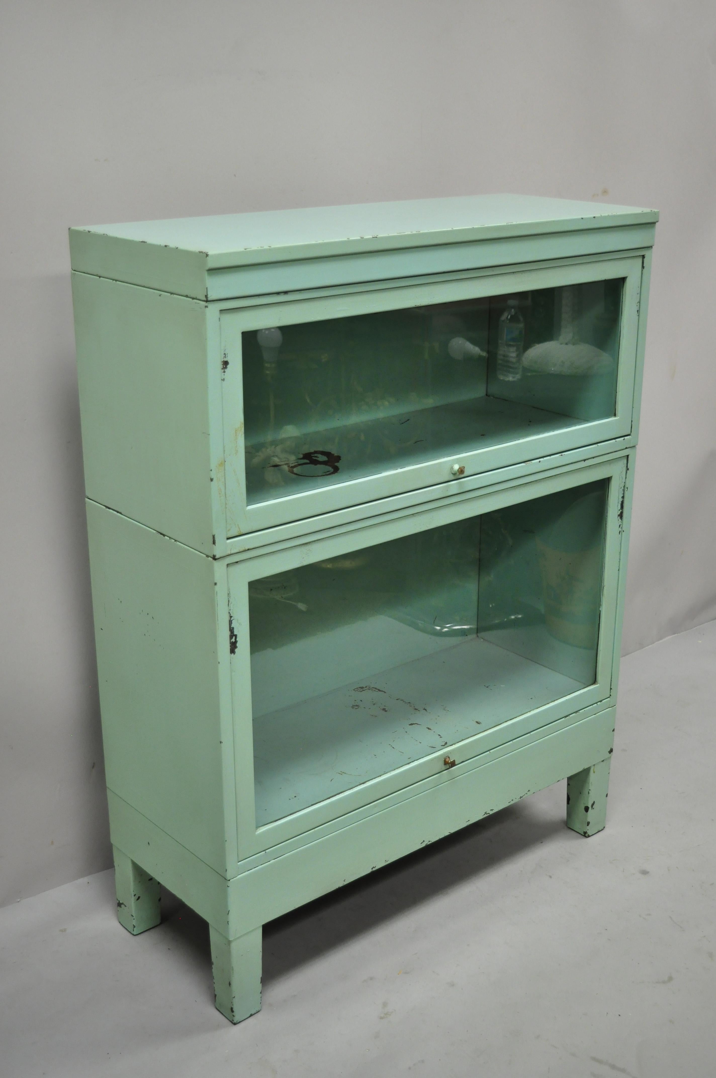 Vintage steel metal green 2 section Barrister Lawyer's stacking bookcase Shaw Walker. Item features steel metal construction, sliding glass doors, green painted finish, 4 part construction, quality American craftsmanship, great style and form, Circa
