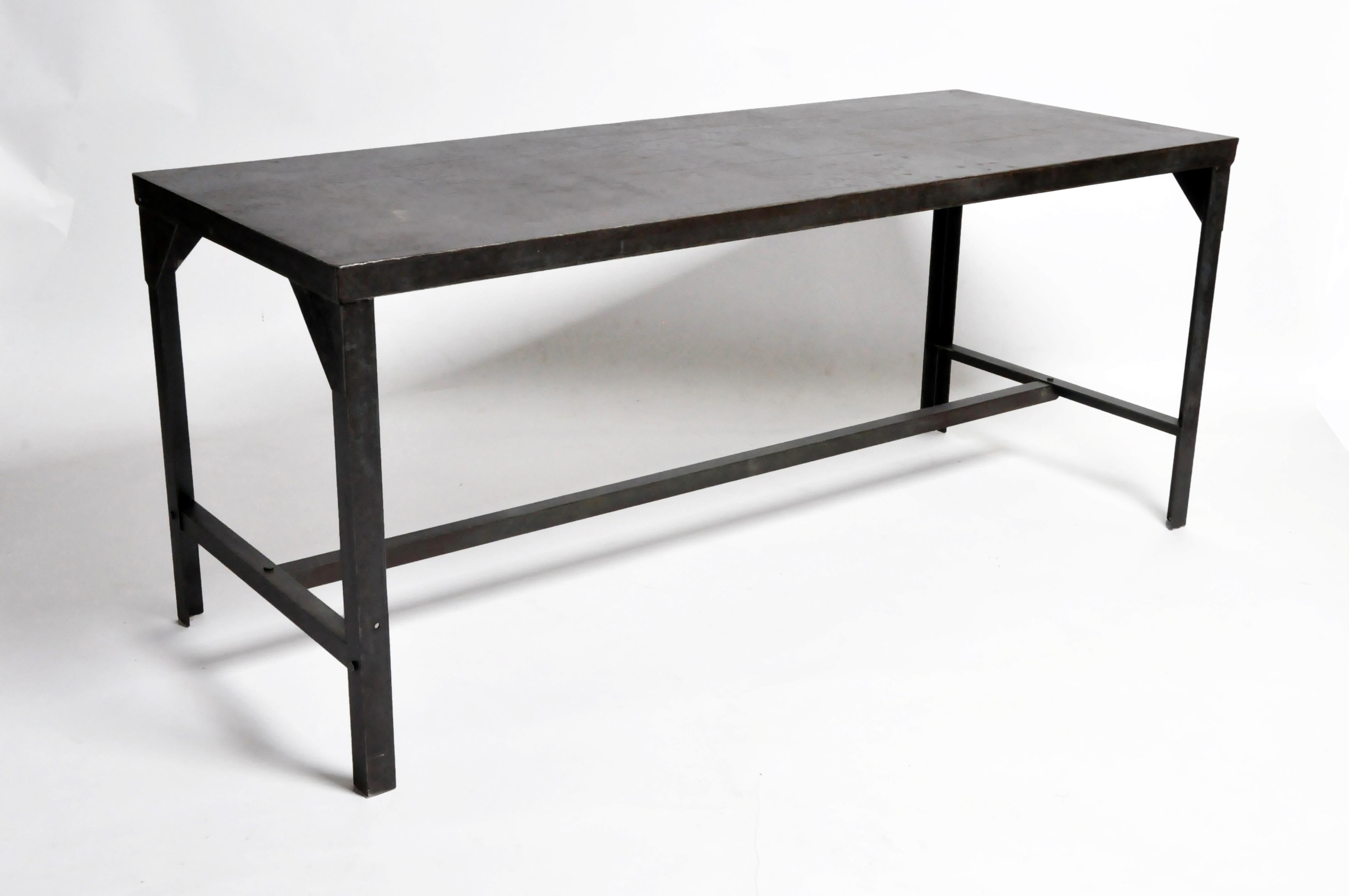 This impressive industrial welder's metal table is from France and was made circa 1960. Much of the original paint has been retained but the top has been cleaned and a sealer applied.