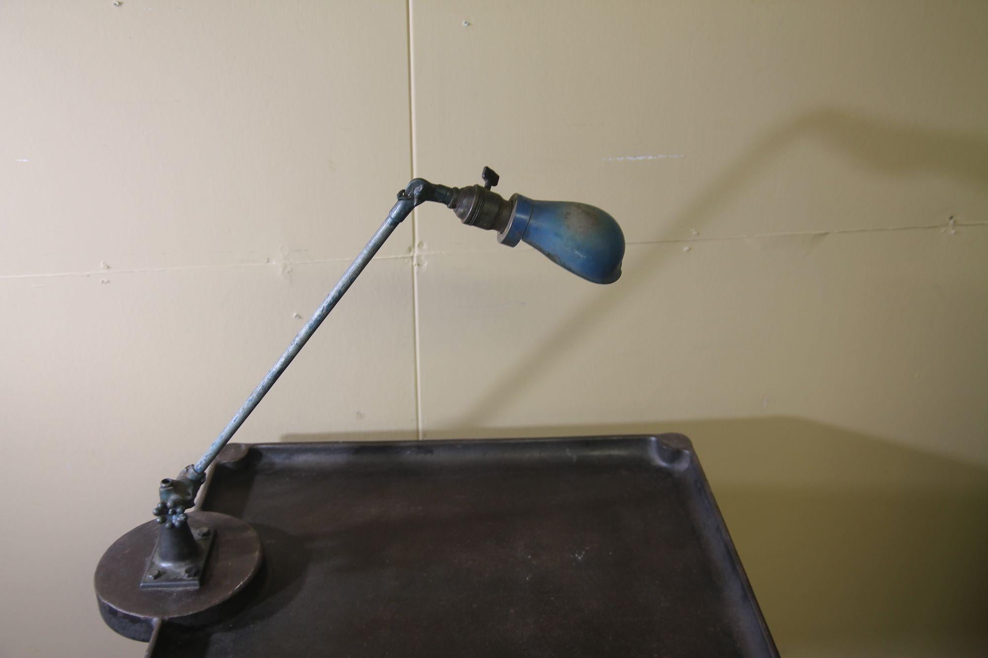 Vintage metal industrial work table with OC white lamp attached For Sale 2