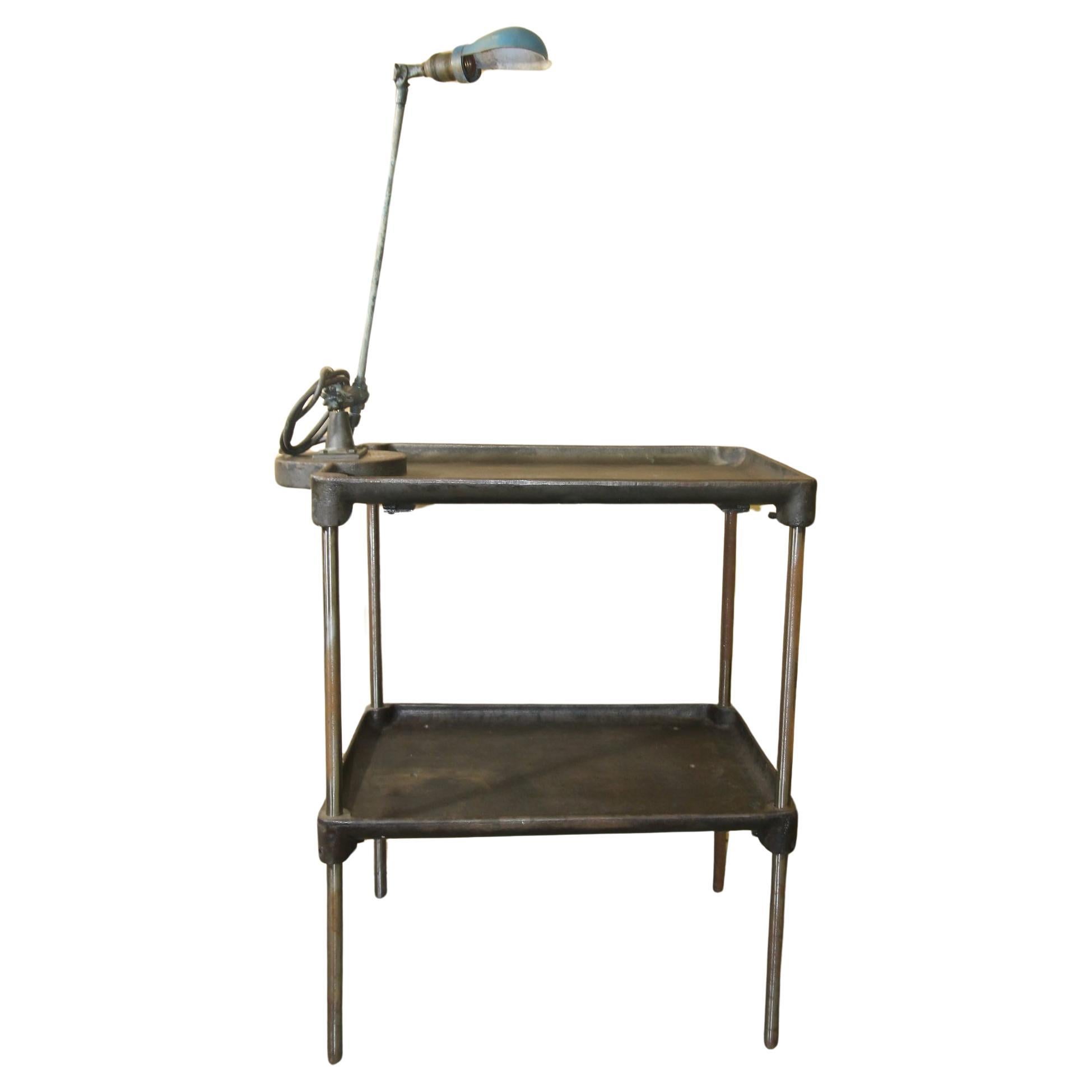 Vintage metal industrial work table with OC white lamp attached For Sale