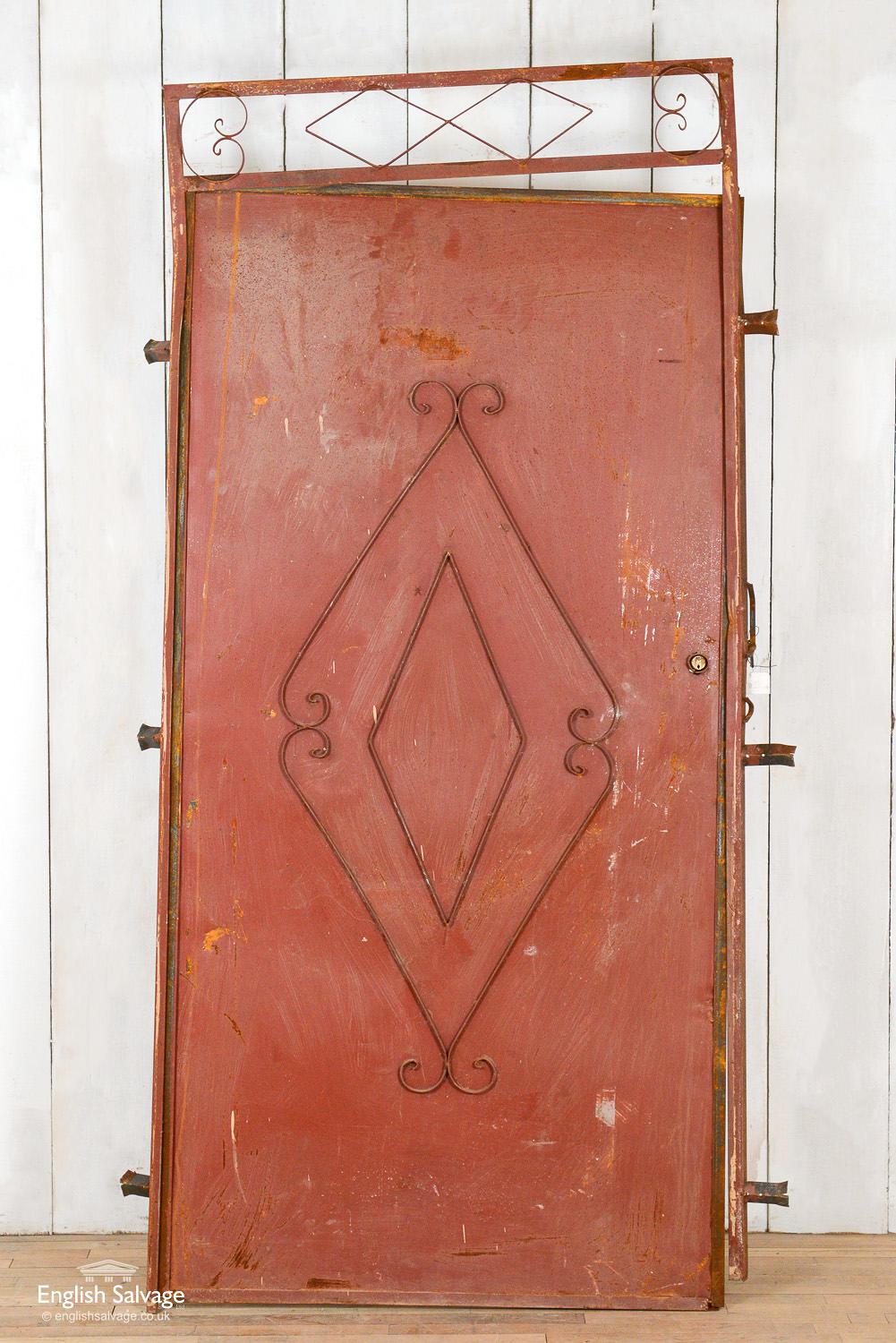 Vintage metal single door in frame reclaimed from Morocco. The door is 101cm wide x 201cm high. The frame needs straightening, there are a few bumps and knock to edges plus a lock hole present.