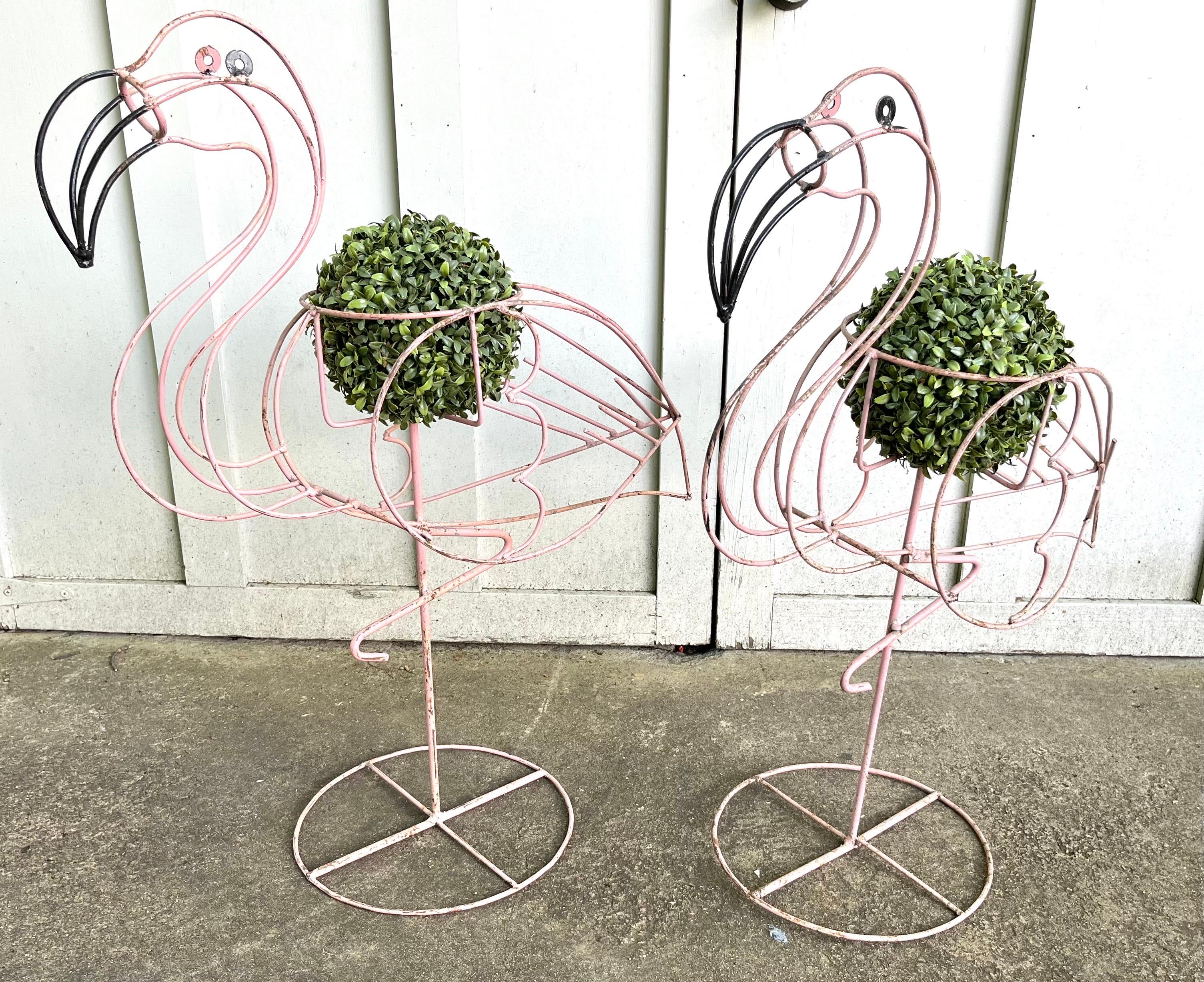 Great Pair of Vintage Metal Flamingo Plant Stands. These stand 37 inches tall by 33 inches wide by 10 inches deep and will hold a 9 inch planter.. They are just so much fun. Each one is showing age-appropriate wear some very minor paint loss and