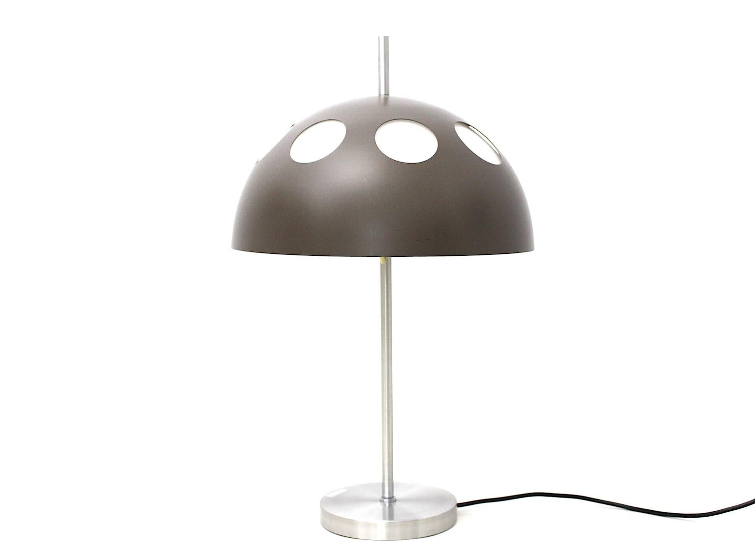 This vintage table lamp by RAAK, Netherlands, 1980s, was made of stainless steel, brown plastic and plexiglass.
Also the table lamp shows an on/off switch.
The vintage condition is good. A small crack at the white inlaid shade, which is not visible