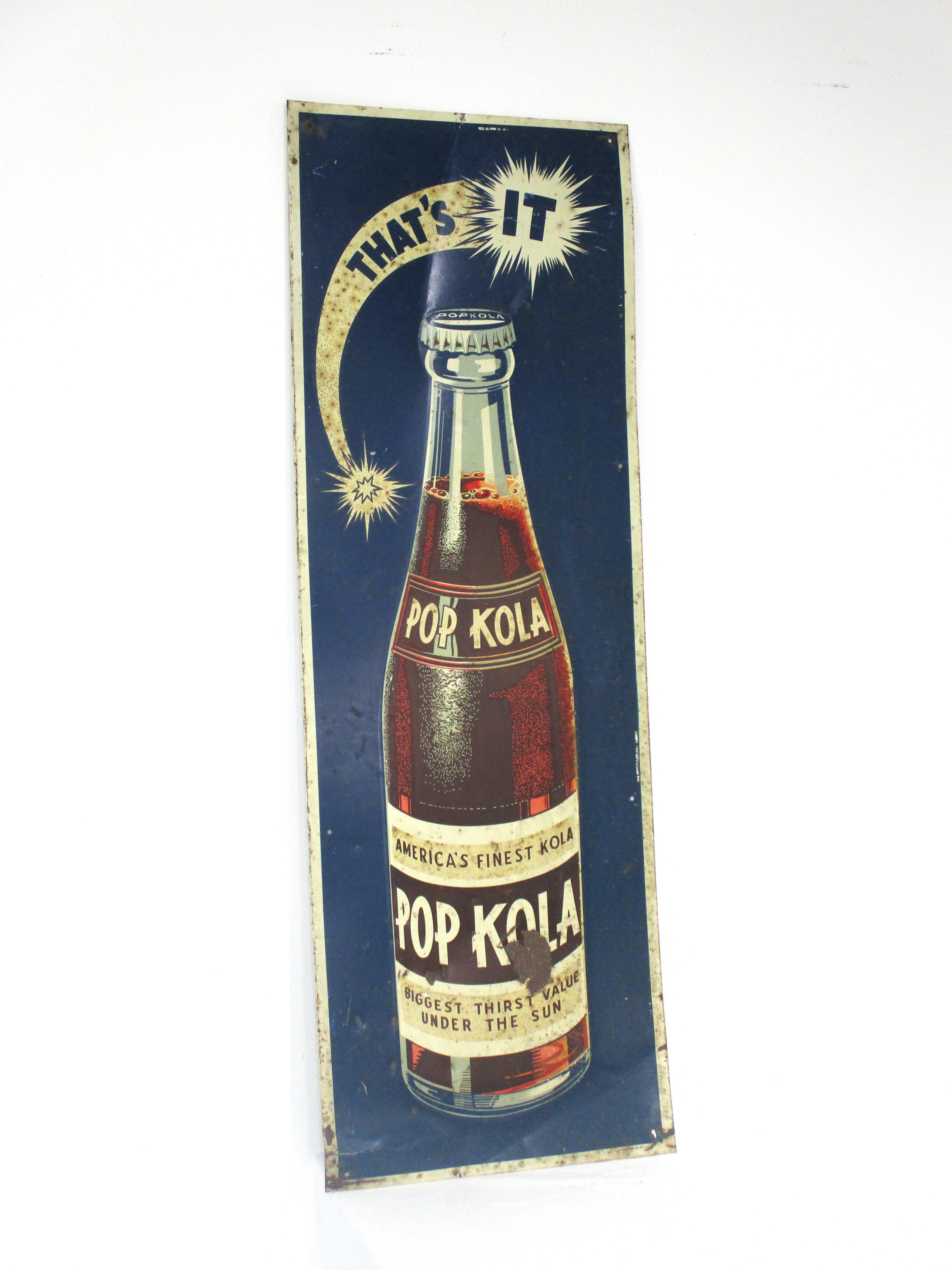 A vintage advertising sign for Pop Kola 