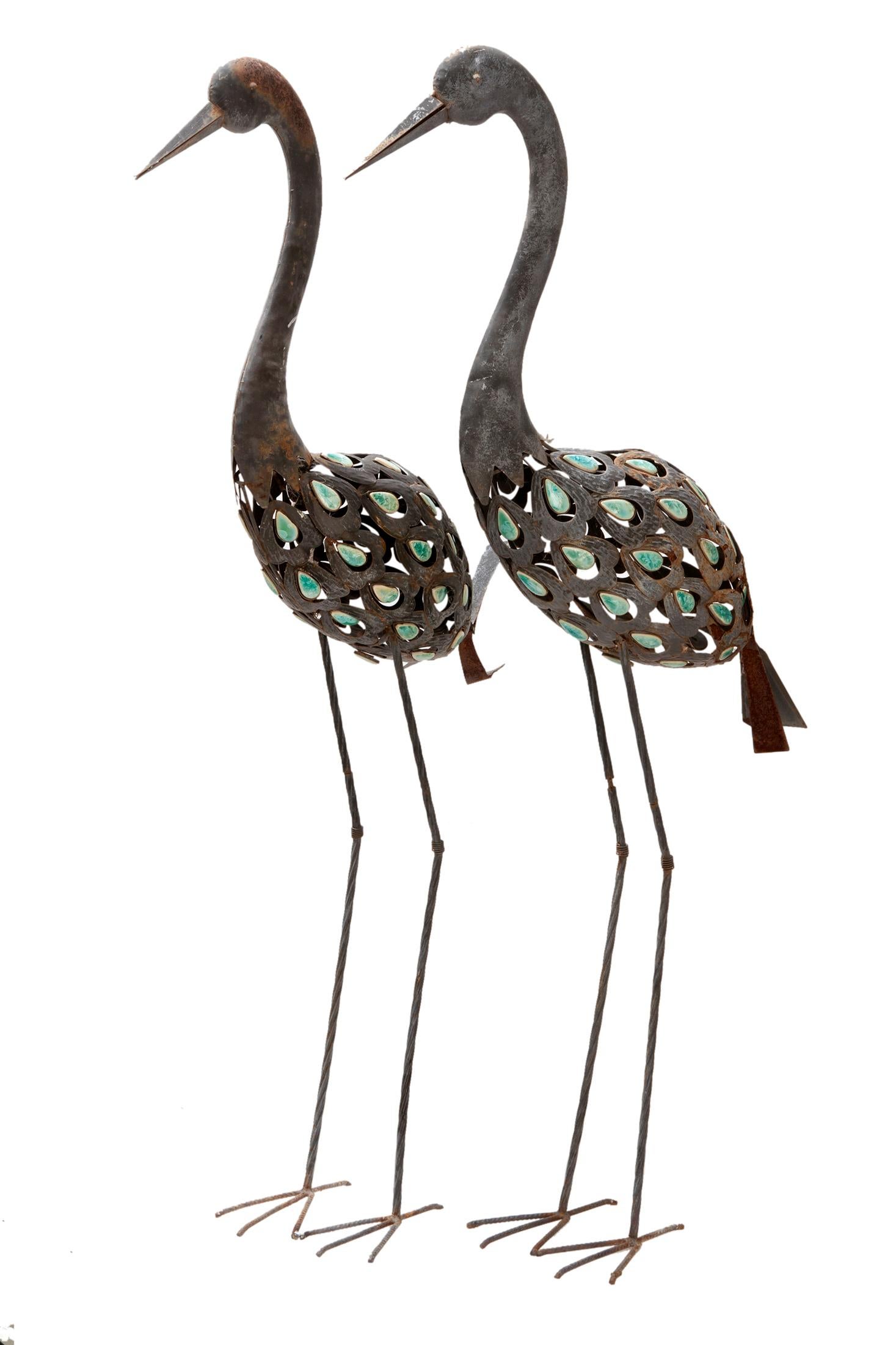 Vintage pair of shorebird statues on iron legs, the bodies are in metal with tear drop set stones in shades of turquoise. The metal is in good condition overall however there is some rust on the tails and a few spots on the bodies as well.
A