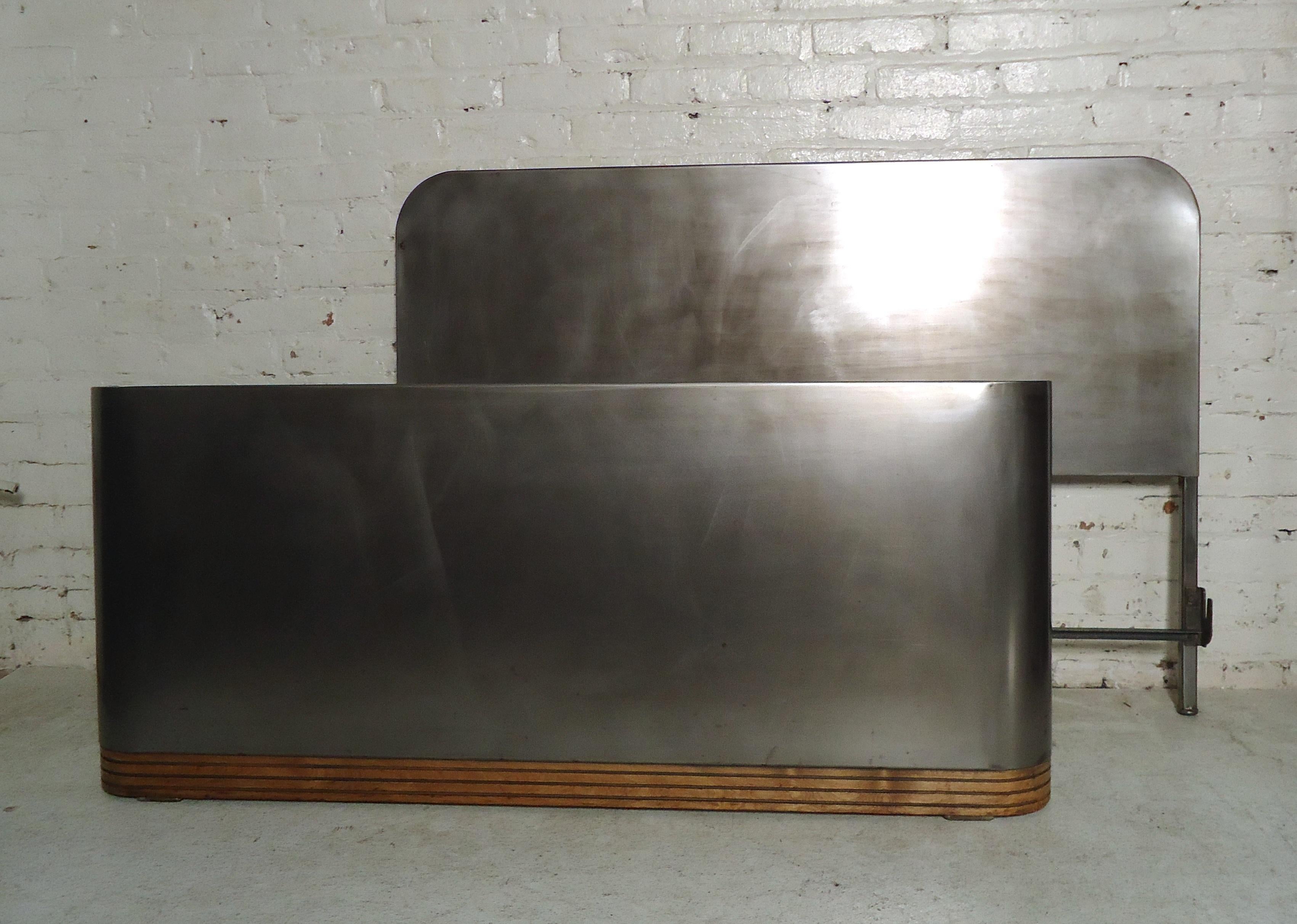 Metal bed frame designed by Simmons with rails included. Restored in an industrial bare metal style finish. (Please confirm item location - NY or NJ - with dealer). 

Footboard measurements: 55 W, 2 D, 23.5 H.