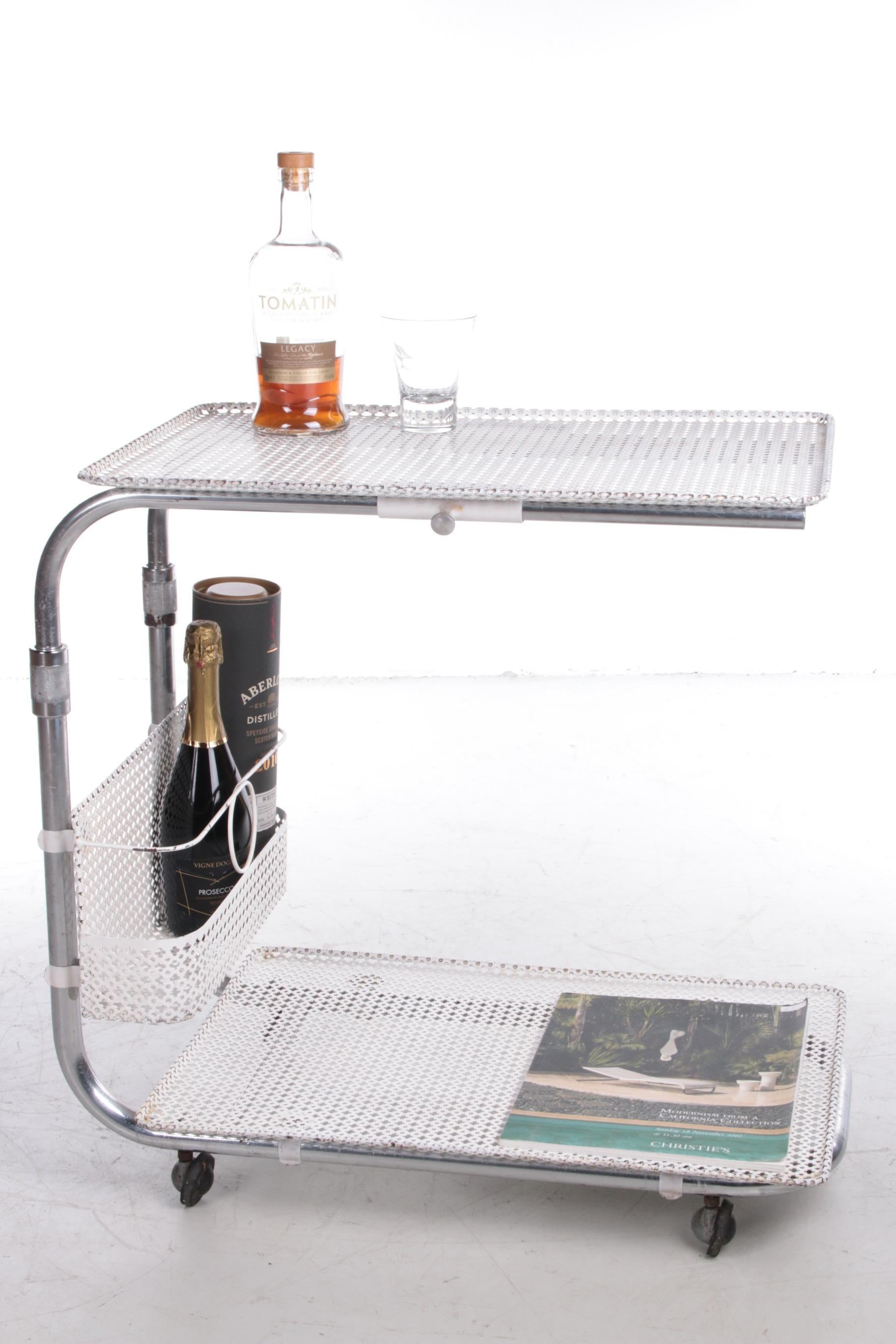 Vintage metal trolley by Mathieu Mategot, 1960s.


Very classic and very nice bar serving. Trays and bottle holders made of ivory-coloured perforated sheet steel. Chromed tubular structure on wheels. Height adjustable structure. Minor signs of