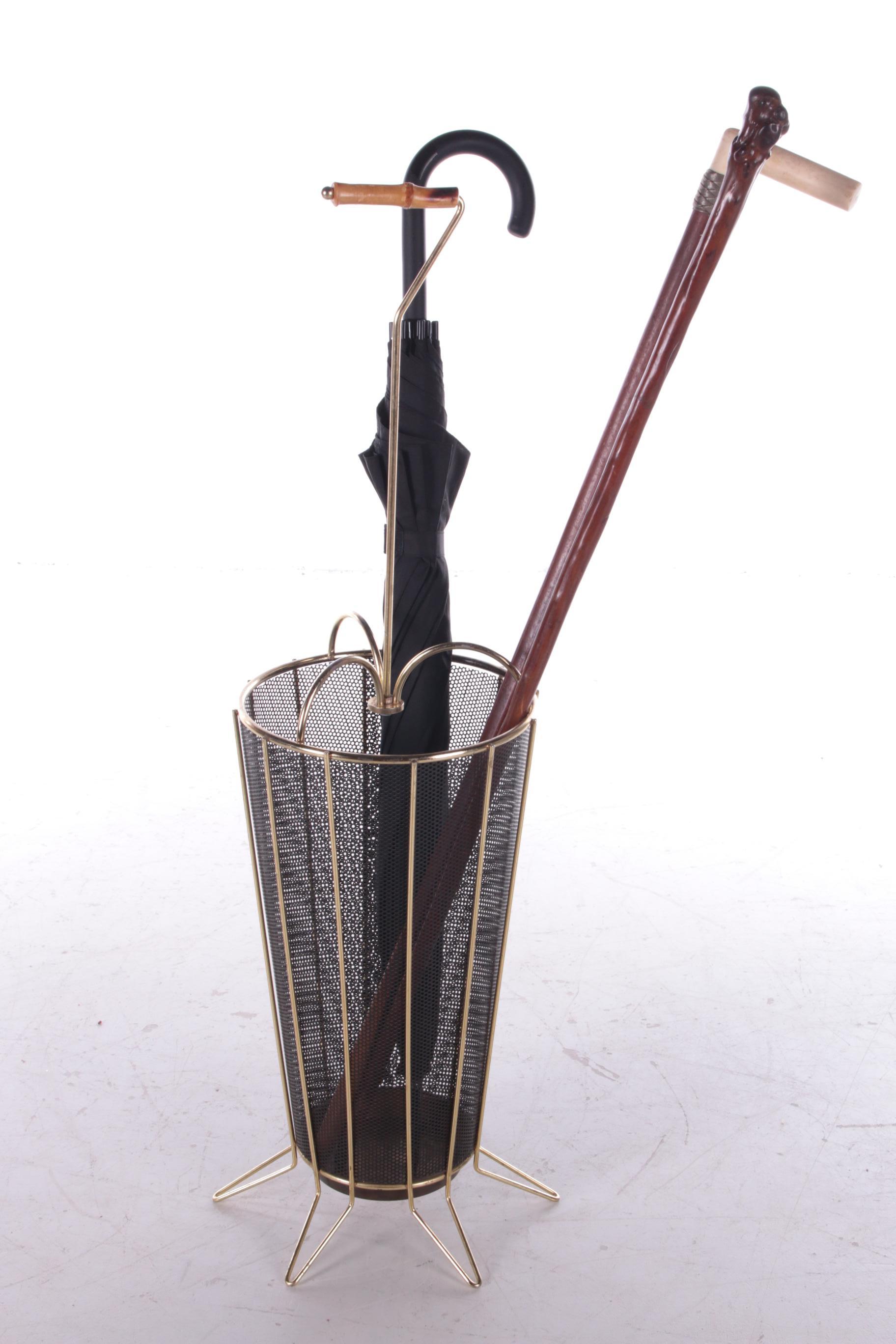 Vintage umbrella stand from the sixties.
Finished in black perforated metal with a chrome frame. the condition is good,
How nice is this in your hall to store the umbrellas.
The handle is made of a piece of bamboo.