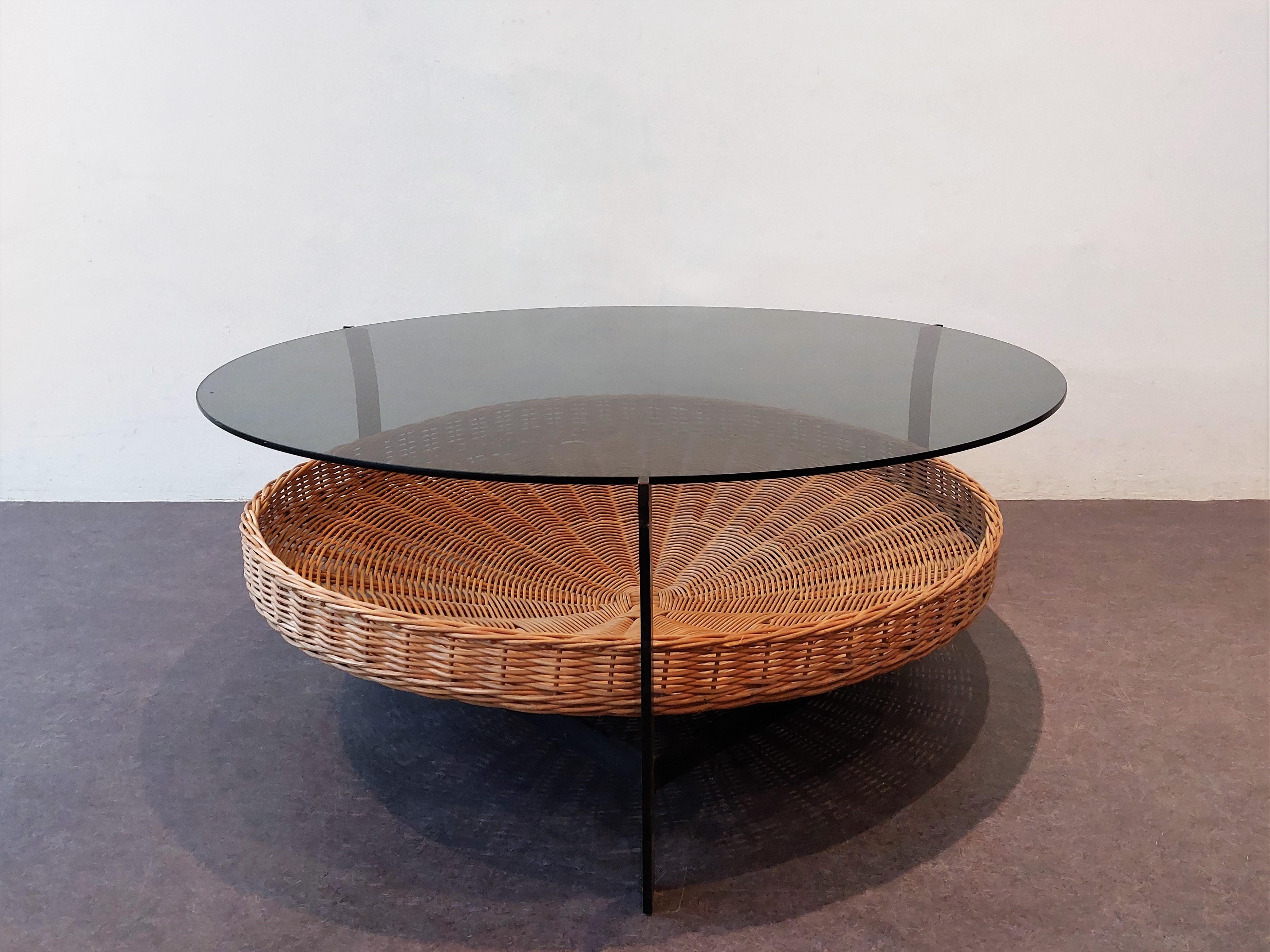 The design of this table shows similarities to the designs and productions of Janni van Pelt, Martin Visser and/or Rohé. It does have scratches to the darker smoked glass top from use. The glass has two little spots that show that this is a high