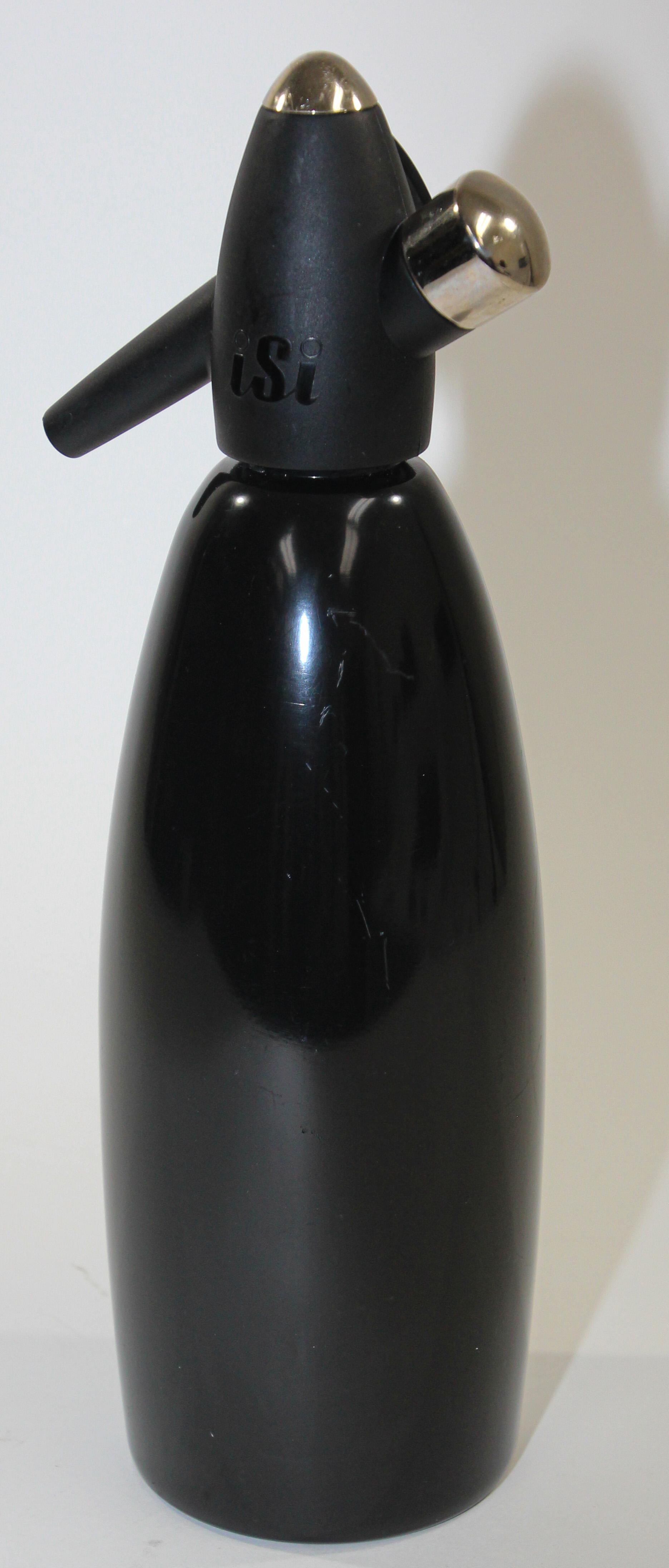 This is a fantastic Vintage Metallic black Metal Austrian ISI Soda Siphon seltzer bottle.
Enjoy the fresh and healthy fizz of sparkling water, carbonated juice drinks, wine spritzers, and handcrafted cocktails. 
Vintage modern barware decor soda