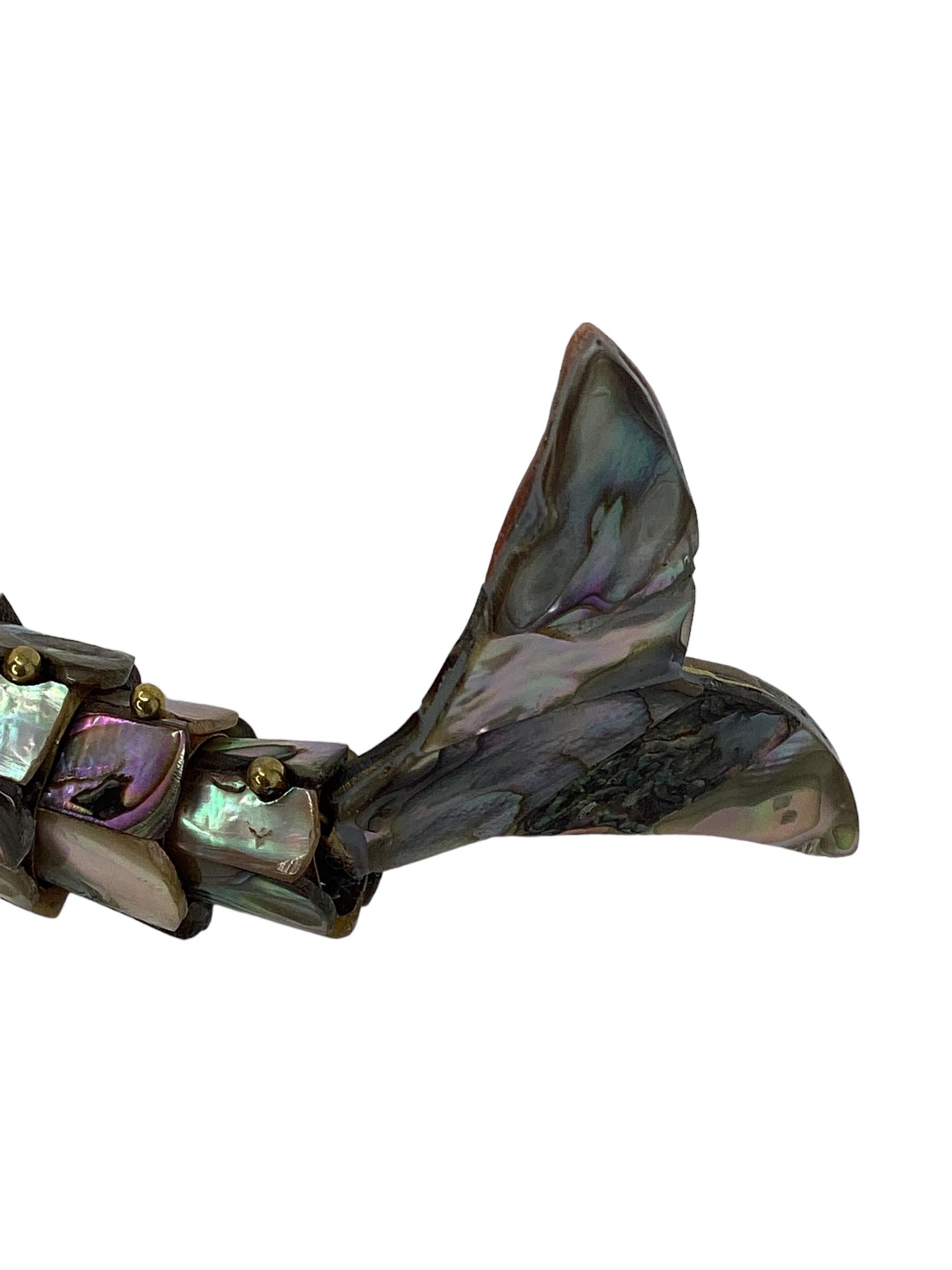 Vintage Mexican Articulated Abalone Fish Bottle Opener. Colorful abalone tiles adorn the fish figure. A fun addition to any bar.